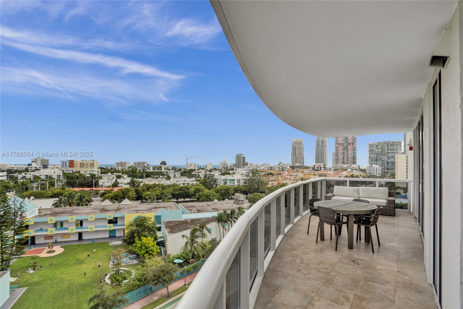 400 Alton Road, Unit 911 Miami Beach, FL 33139 - Photo 20 of 24 a view of a chairs and table in the balcony