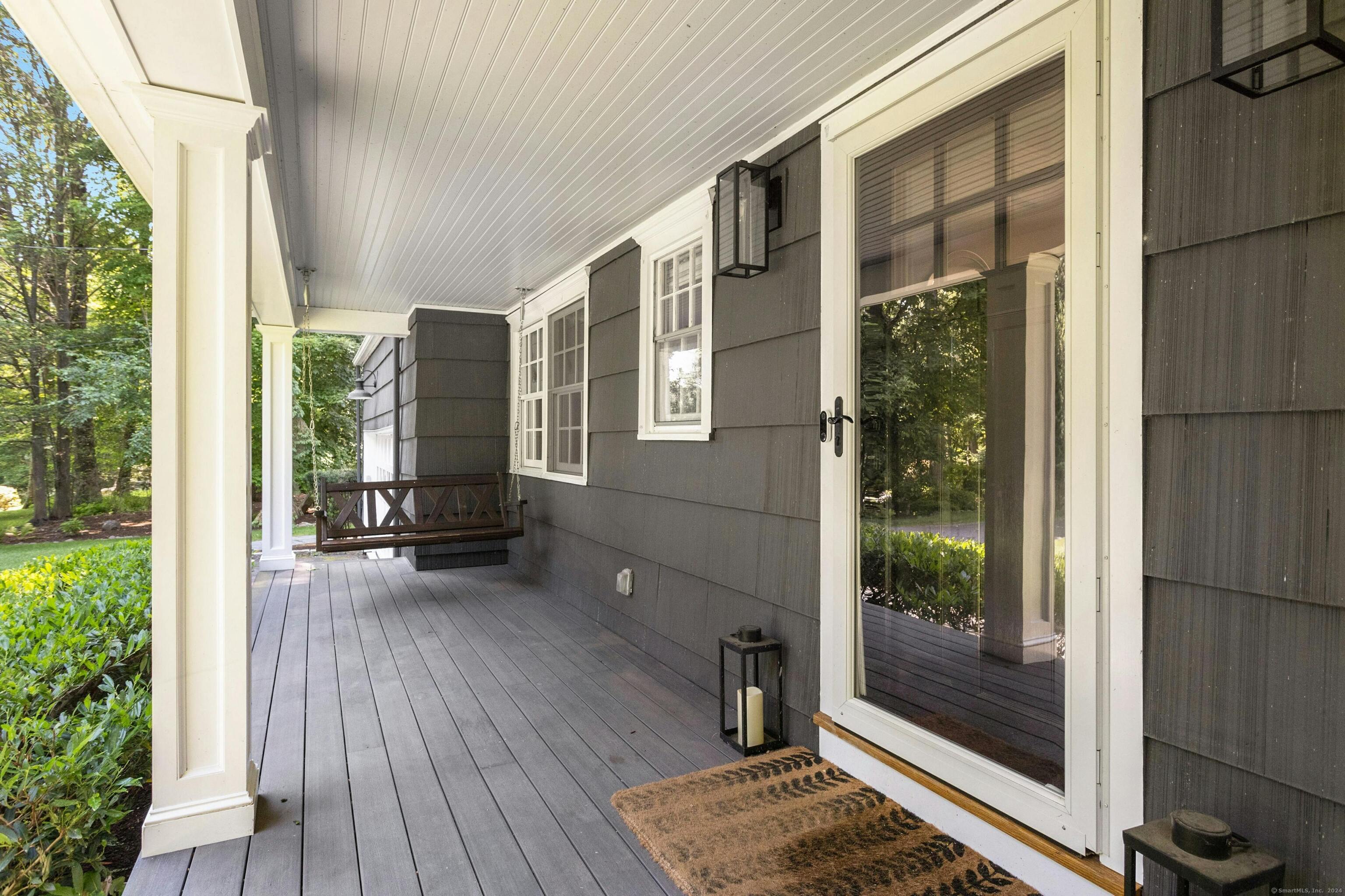 21 Roxbury Lane Wilton, CT 06897 - Photo 4 of 37 The front porch welcomes friends and family -- and perfect for spending time outside!