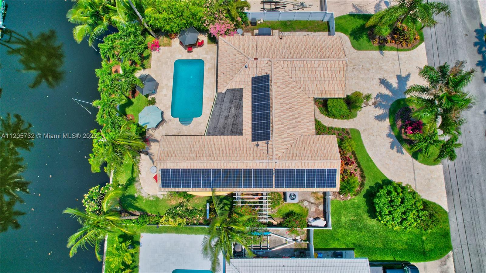 1291 Southwest 4th Court Boca Raton, FL 33432 - Photo 2 of 54 a house view with a garden space