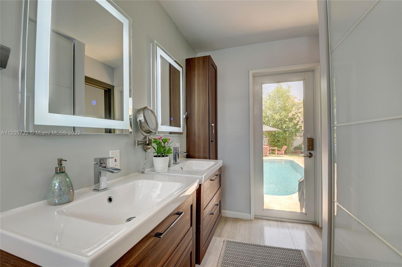 1291 Southwest 4th Court Boca Raton, FL 33432 - Photo 22 of 54 a bathroom with a sink and a bathtub