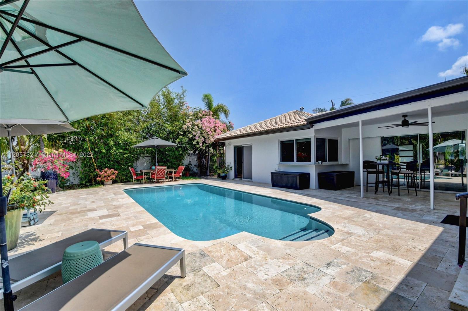 1291 Southwest 4th Court Boca Raton, FL 33432 - Photo 31 of 54 a view of a house with backyard and sitting area
