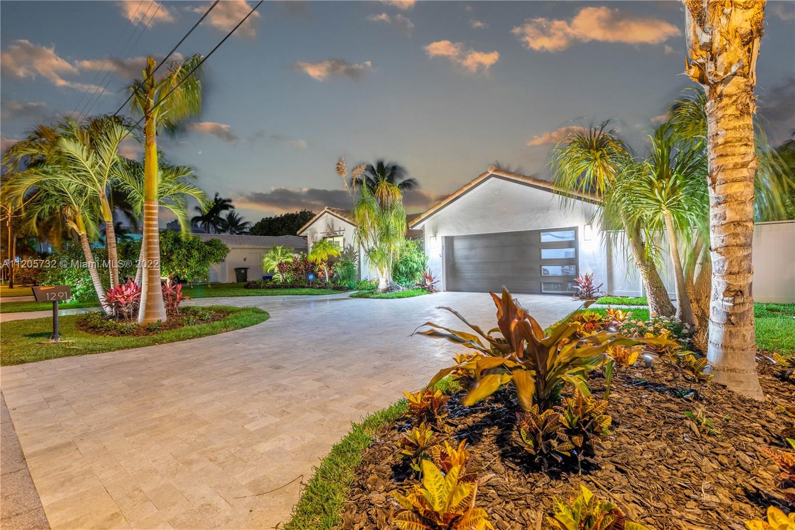 1291 Southwest 4th Court Boca Raton, FL 33432 - Photo 43 of 54 a view of a yard in front of a house