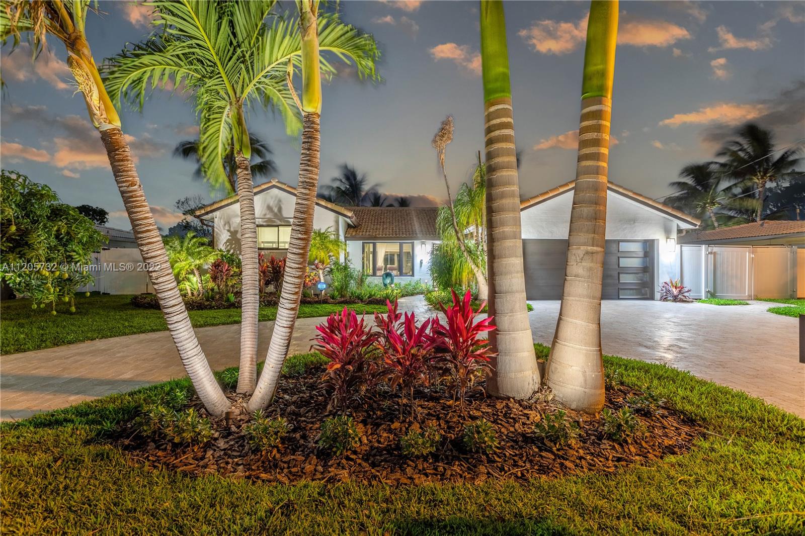 1291 Southwest 4th Court Boca Raton, FL 33432 - Photo 45 of 54 a view of a house with fountain and garden