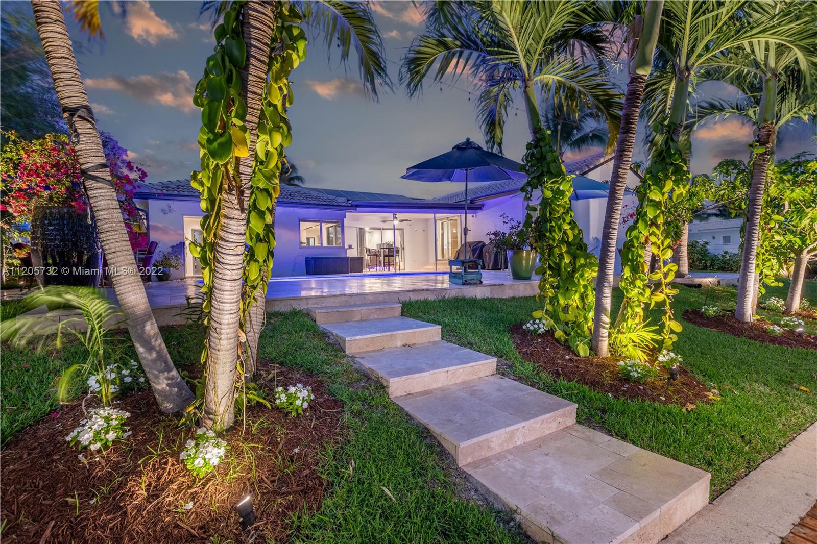 1291 Southwest 4th Court Boca Raton, FL 33432 - Photo 46 of 54 a view of a yard with plants and trees