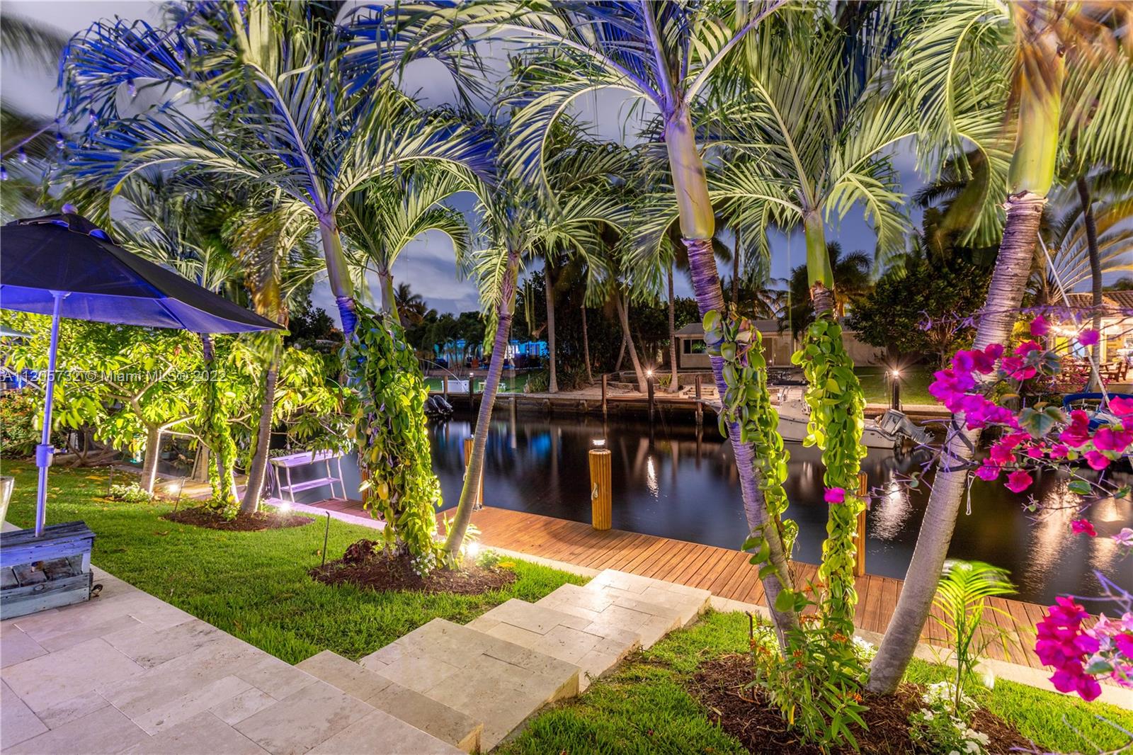 1291 Southwest 4th Court Boca Raton, FL 33432 - Photo 49 of 54 a front view of a multi story building with yard