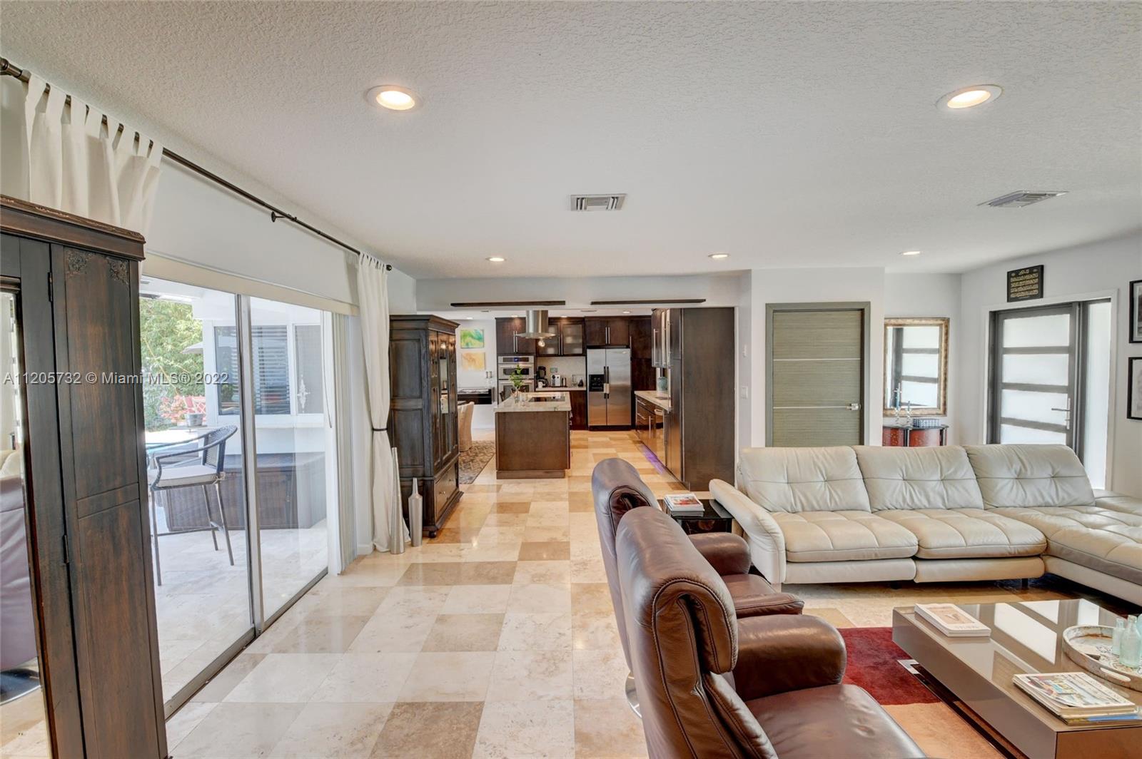 1291 Southwest 4th Court Boca Raton, FL 33432 - Photo 8 of 54 a living room with furniture and a large window