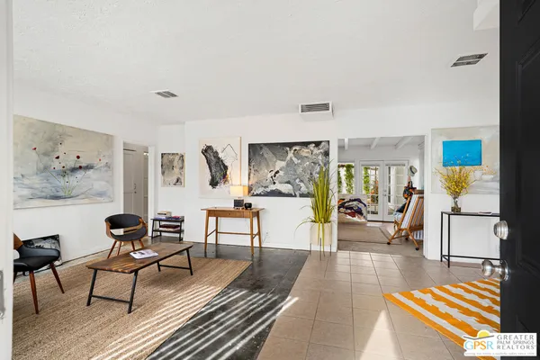 a living room with furniture and a table