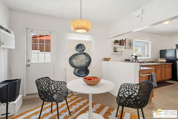 a dining room table chairs and a table