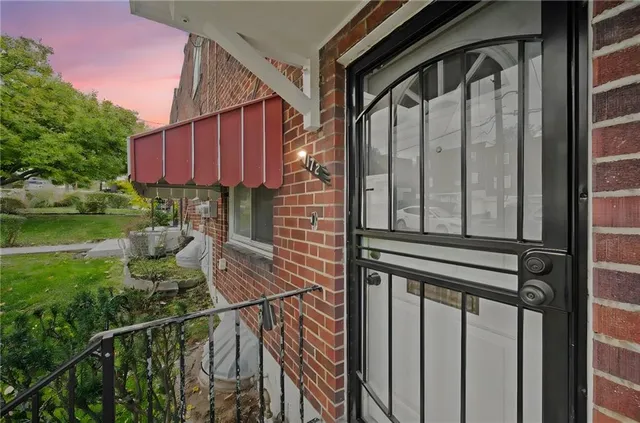 a view of a chair and table in the balcony