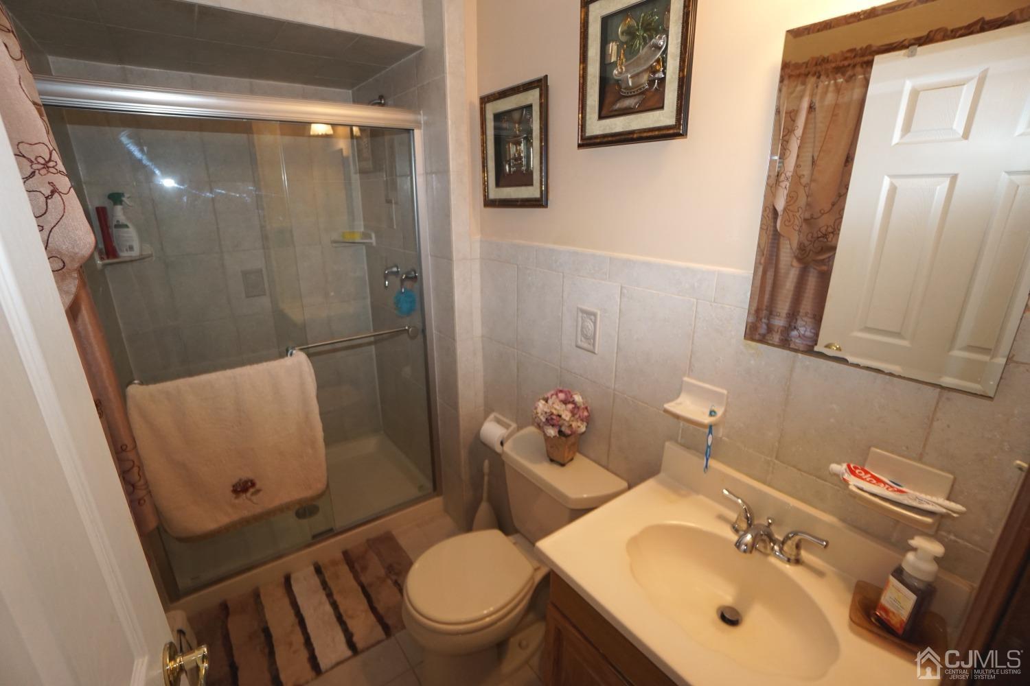 77 Inwood Avenue Colonia, NJ 07067 - Photo 16 of 37 a bathroom with a sink toilet and shower