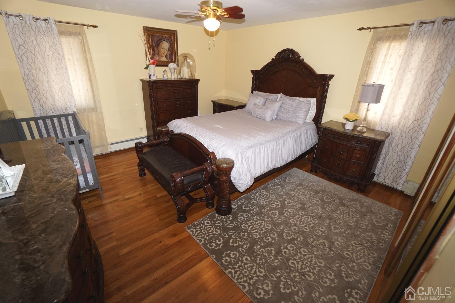 77 Inwood Avenue Colonia, NJ 07067 - Photo 17 of 37 a bedroom with a bed and window