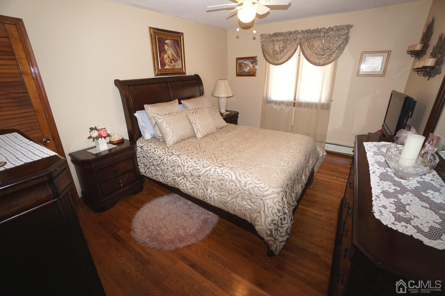 77 Inwood Avenue Colonia, NJ 07067 - Photo 18 of 37 a bedroom with a bed and a window