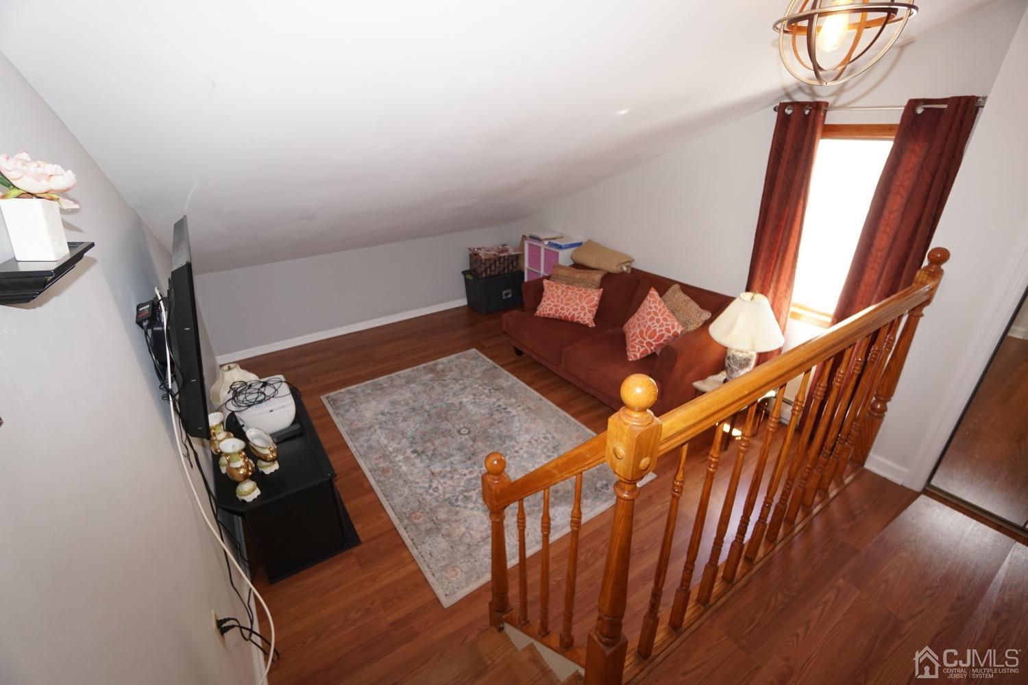 77 Inwood Avenue Colonia, NJ 07067 - Photo 19 of 37 a view of an entryway with furniture and wooden floor