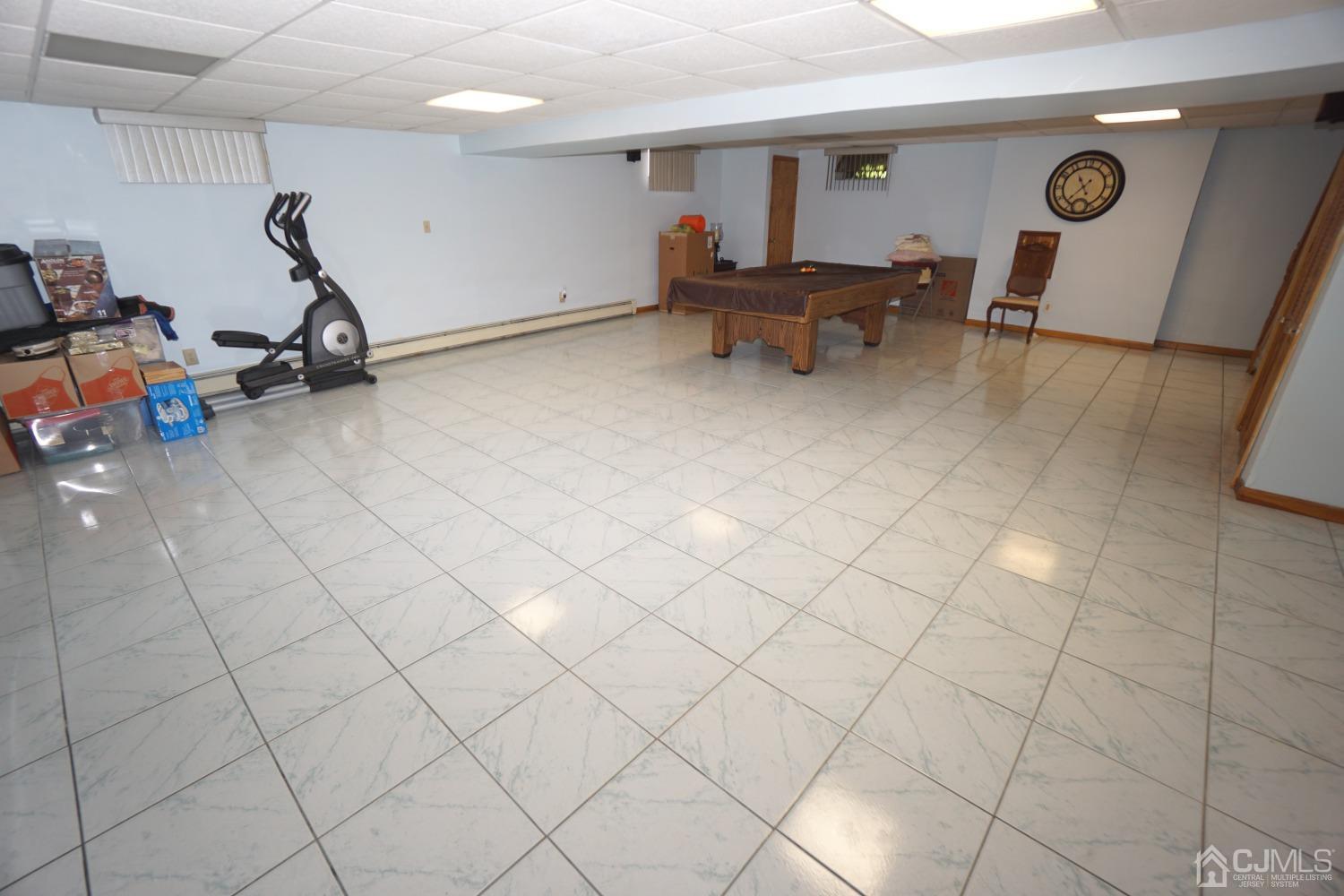 77 Inwood Avenue Colonia, NJ 07067 - Photo 23 of 37 a view of a room with gym equipment and a window