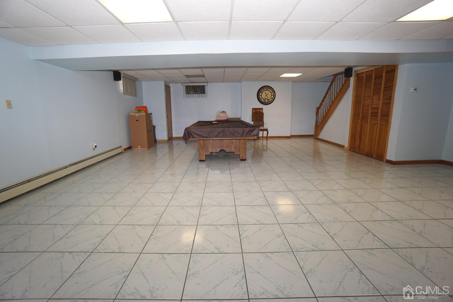 77 Inwood Avenue Colonia, NJ 07067 - Photo 24 of 37 a living room with furniture and a fireplace