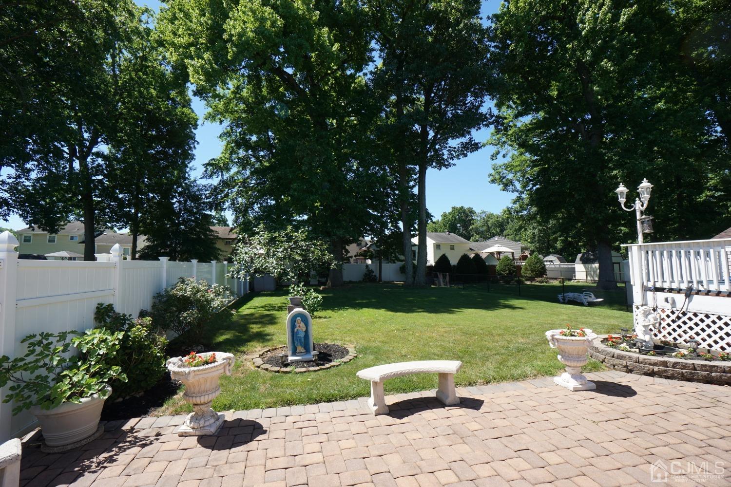 77 Inwood Avenue Colonia, NJ 07067 - Photo 35 of 37 a view of a garden with plants and large tree