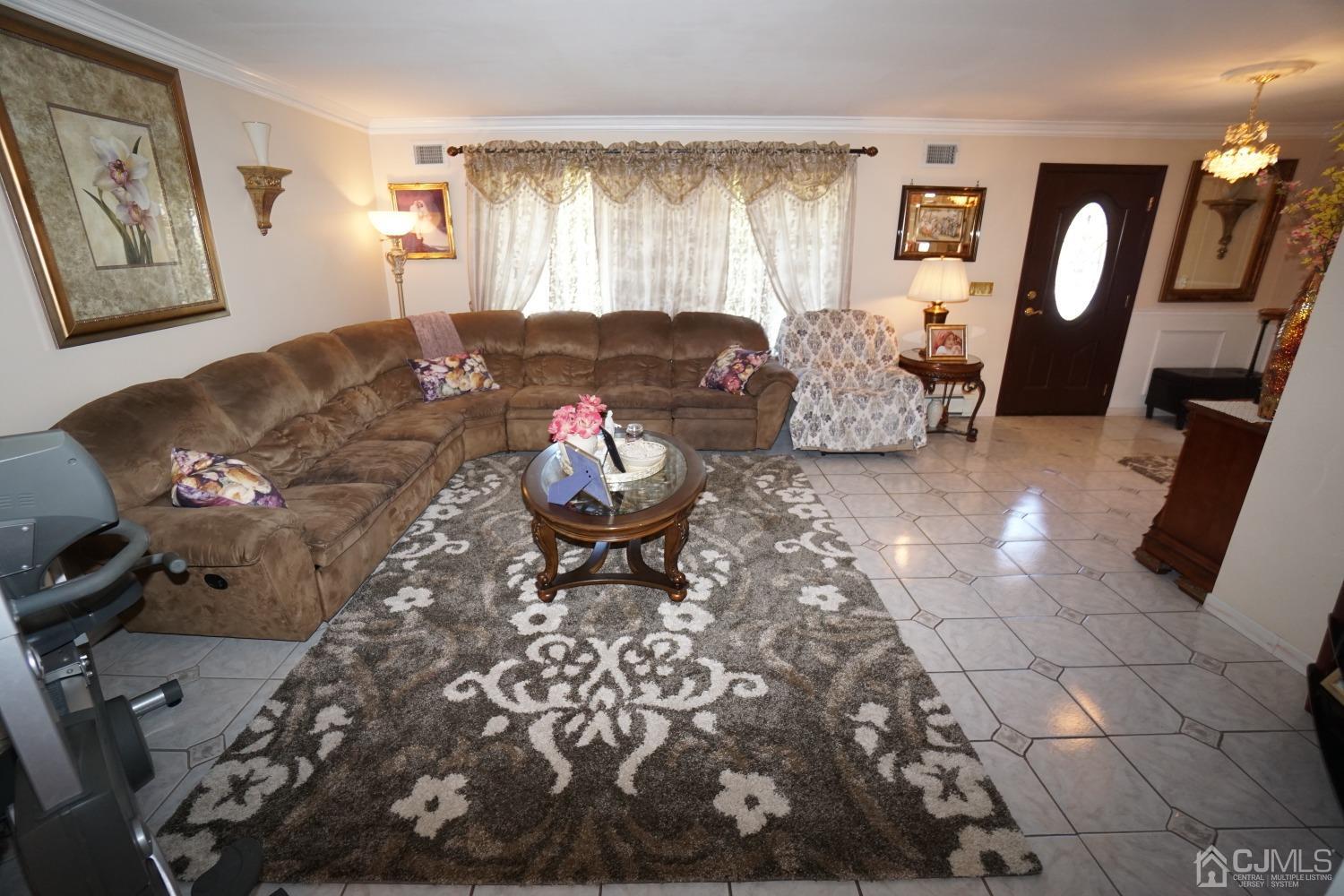 77 Inwood Avenue Colonia, NJ 07067 - Photo 5 of 37 a living room with furniture and wooden floor