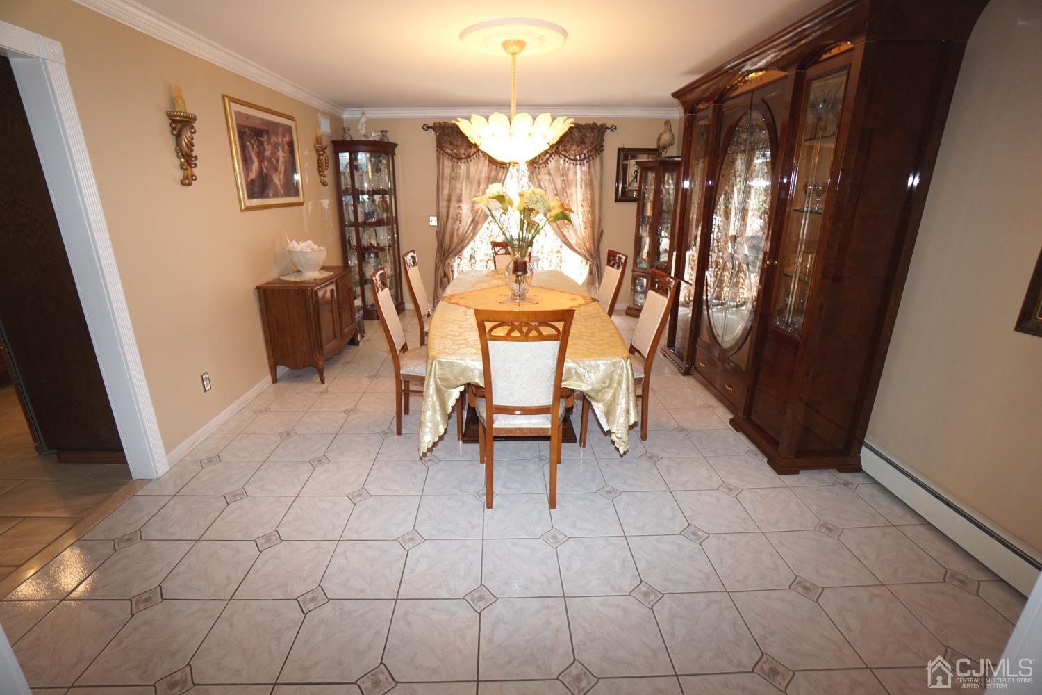 77 Inwood Avenue Colonia, NJ 07067 - Photo 6 of 37 a dining room with furniture and window