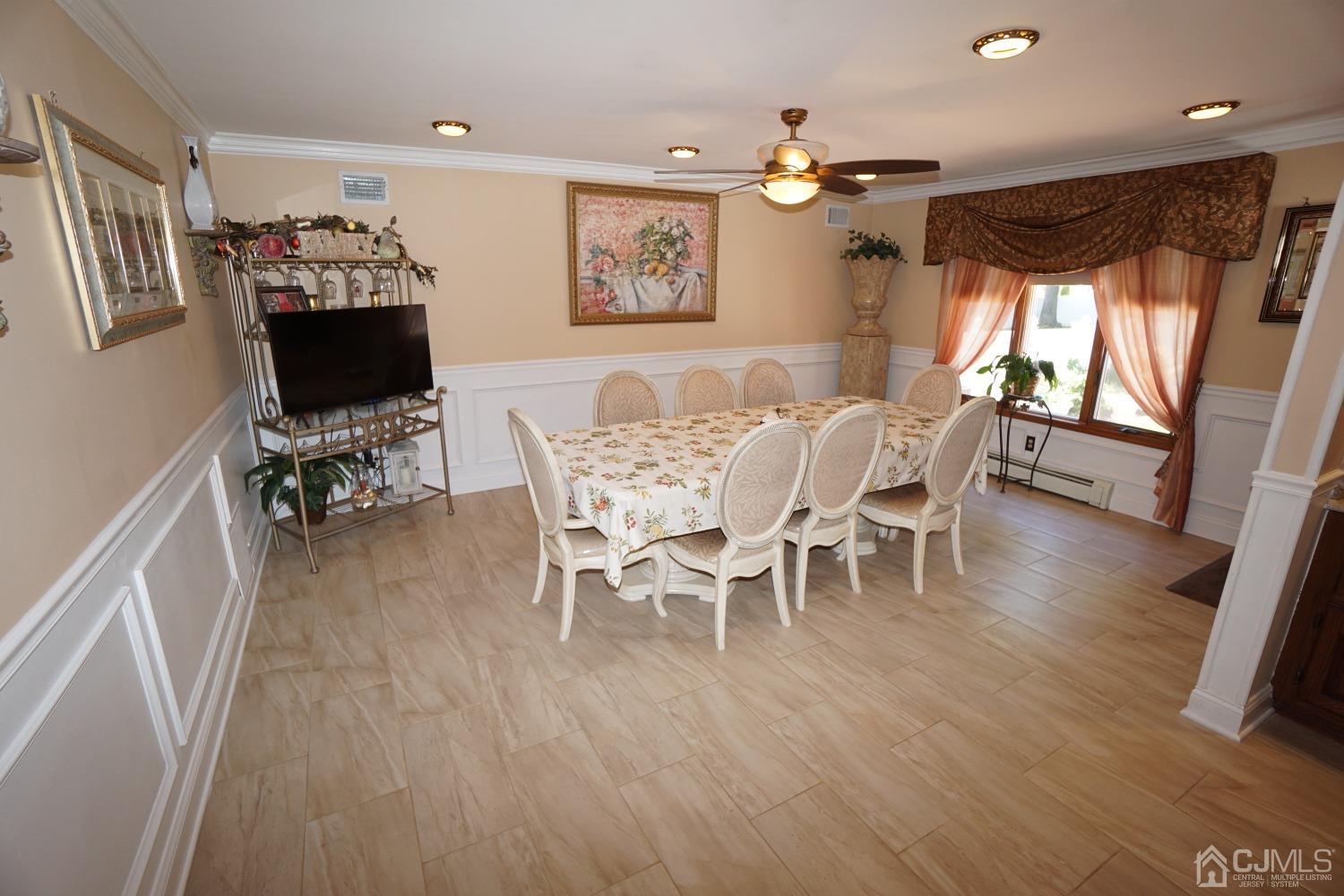 77 Inwood Avenue Colonia, NJ 07067 - Photo 9 of 37 a view of a dining room with furniture and wooden floor
