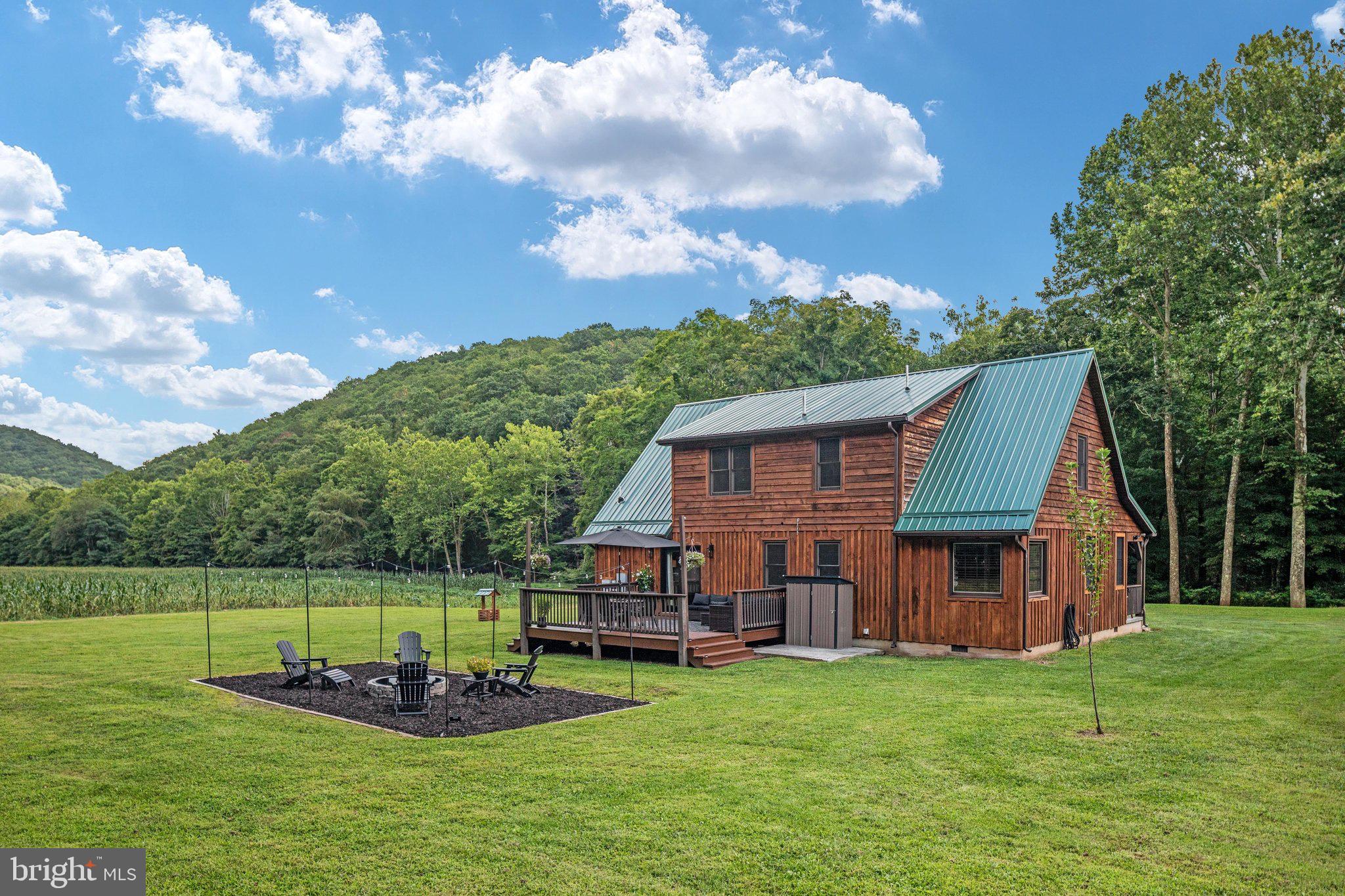 1396 Cullers Run Road Mathias, WV 26812 - Photo 50 of 79 Charming cabin nestled in lush greenery.