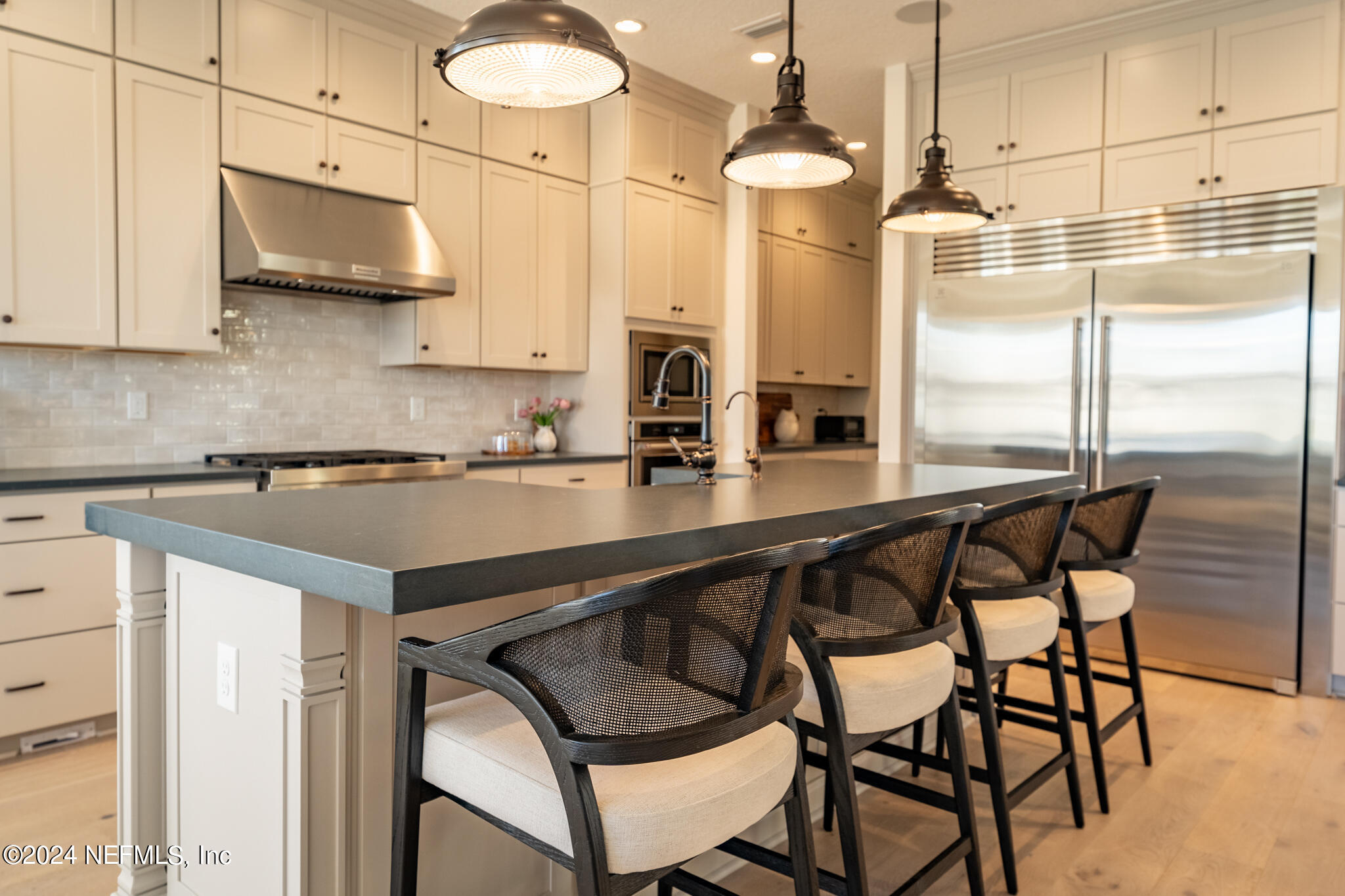 88 Awlleaf Court St. Augustine, FL 32095 - Photo 19 of 107 a kitchen with stainless steel appliances granite countertop a sink and a refrigerator