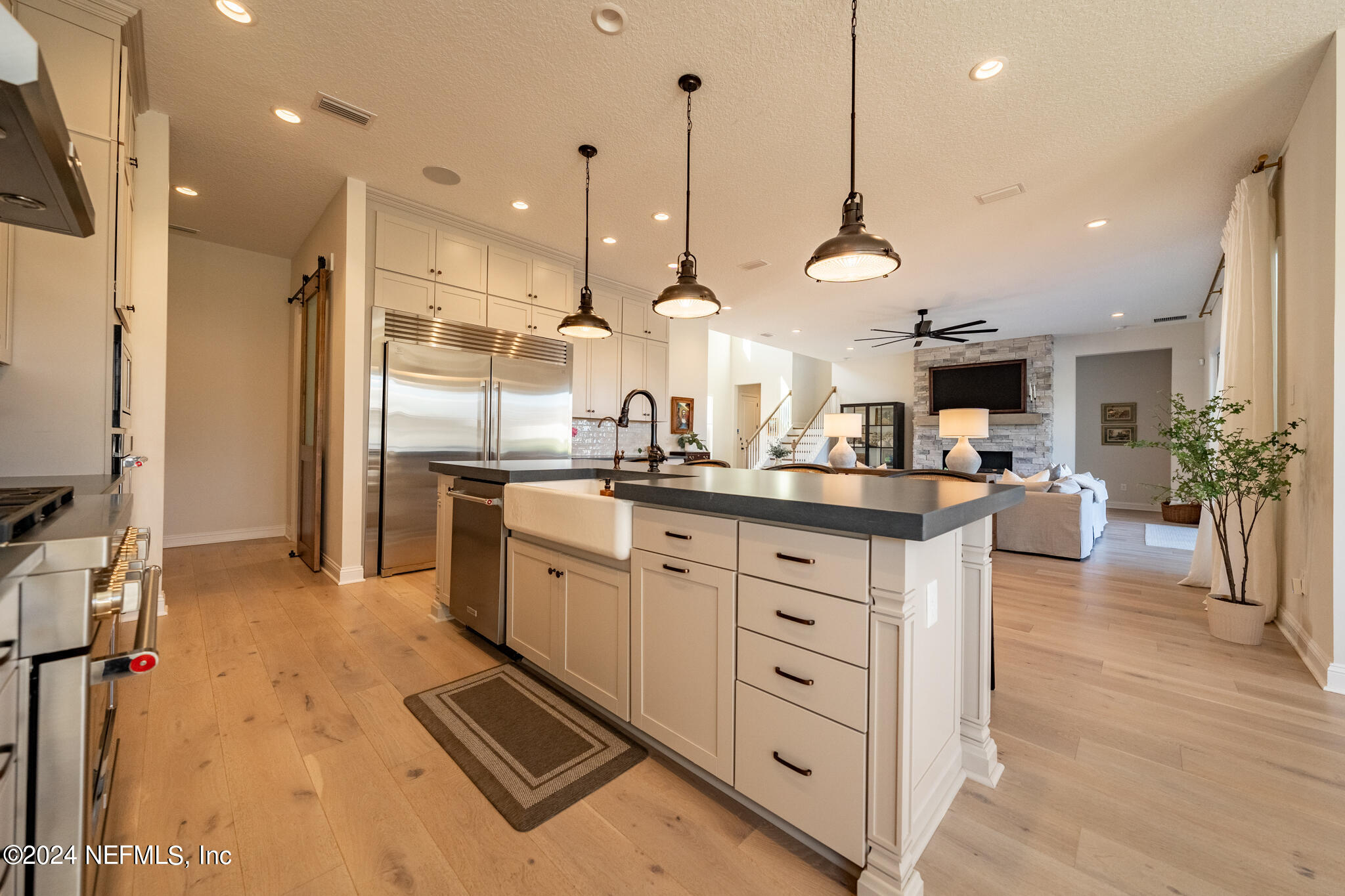 88 Awlleaf Court St. Augustine, FL 32095 - Photo 21 of 107 a kitchen with stainless steel appliances kitchen island granite countertop a sink a counter top space a refrigerator and cabinets