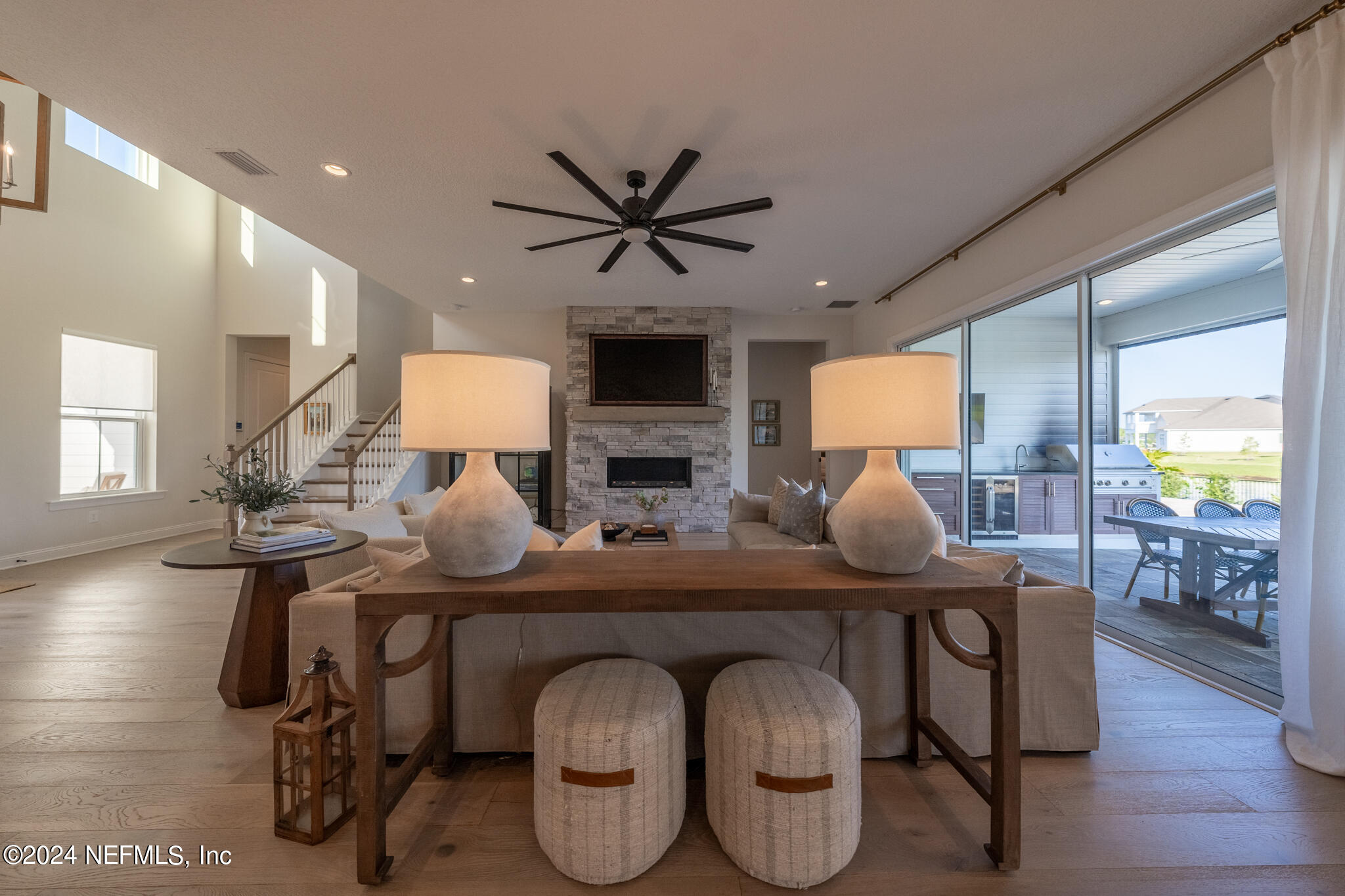 88 Awlleaf Court St. Augustine, FL 32095 - Photo 27 of 107 a living room with furniture a chandelier and wooden floor