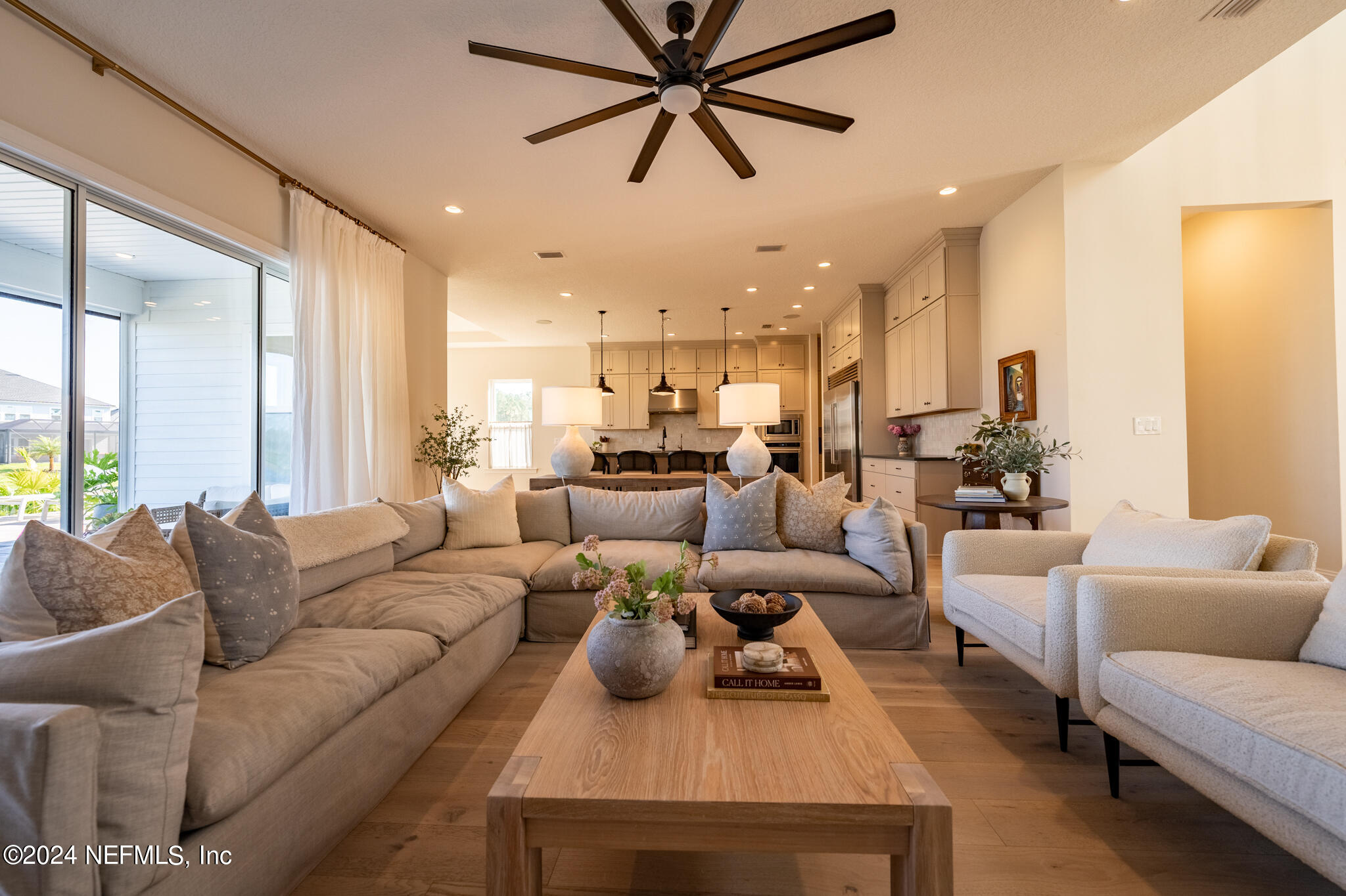 88 Awlleaf Court St. Augustine, FL 32095 - Photo 30 of 107 a living room with furniture kitchen view and a large window