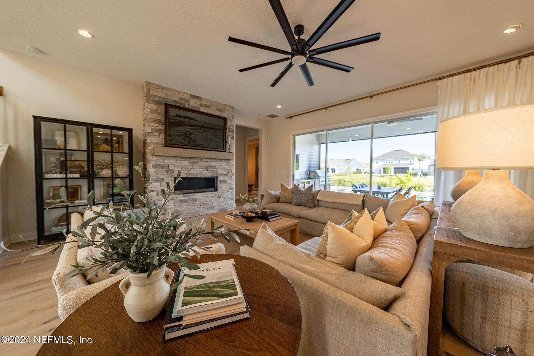 88 Awlleaf Court St. Augustine, FL 32095 - Photo 32 of 107 a living room with furniture fireplace and a flat screen tv