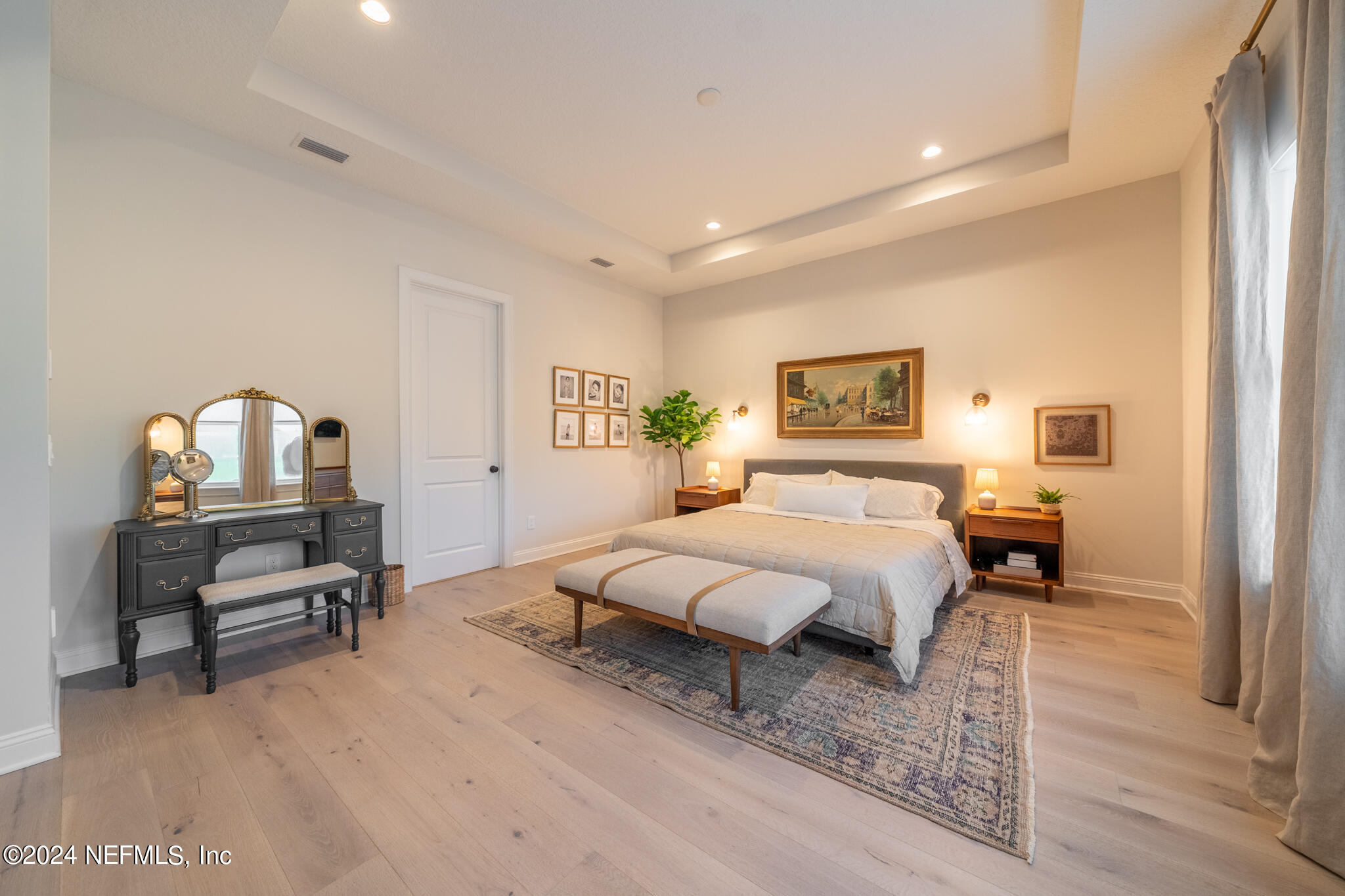 88 Awlleaf Court St. Augustine, FL 32095 - Photo 35 of 107 a spacious bedroom with a bed a table and chair