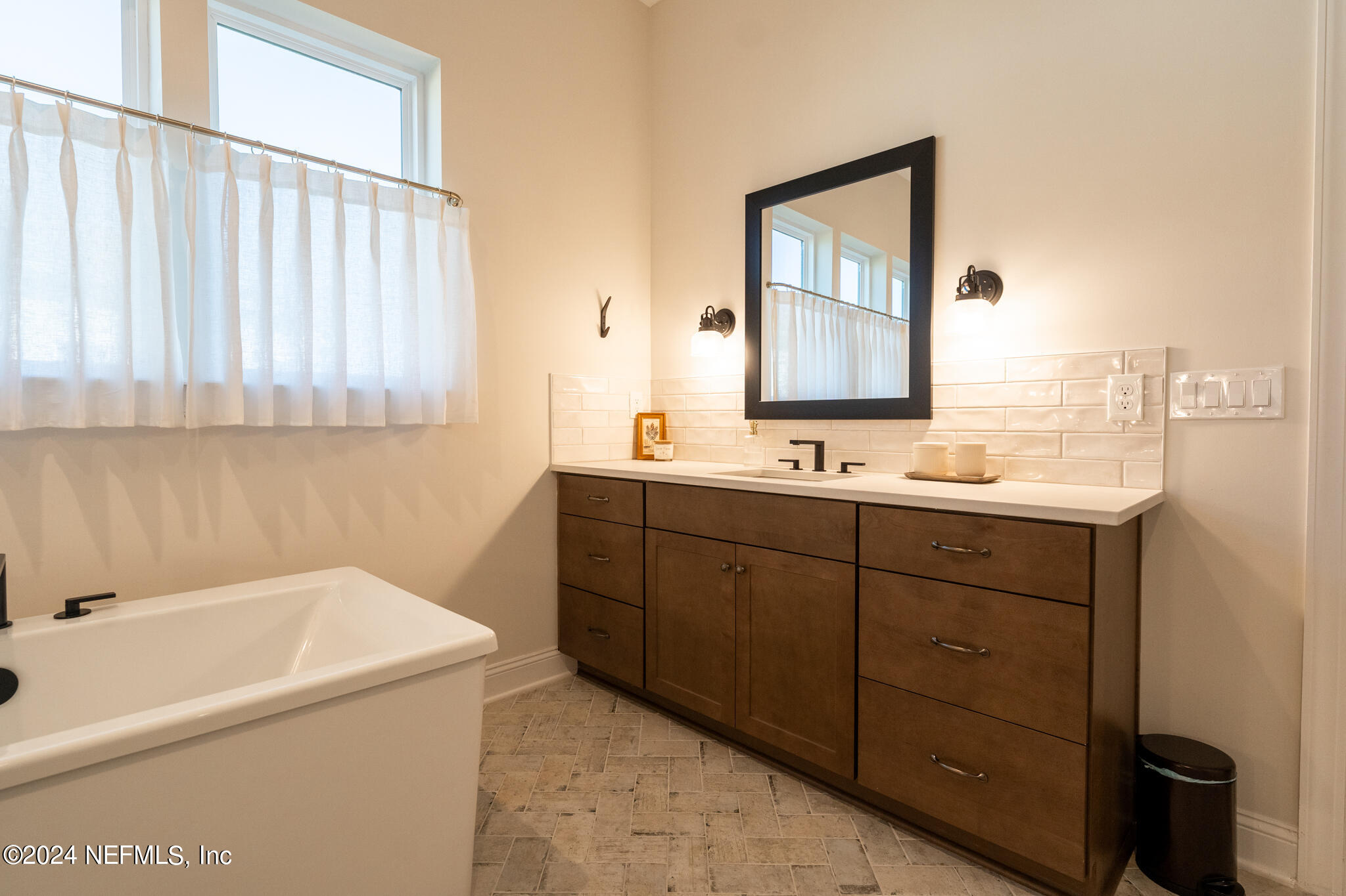 88 Awlleaf Court St. Augustine, FL 32095 - Photo 37 of 107 a bathroom with a sink and a mirror