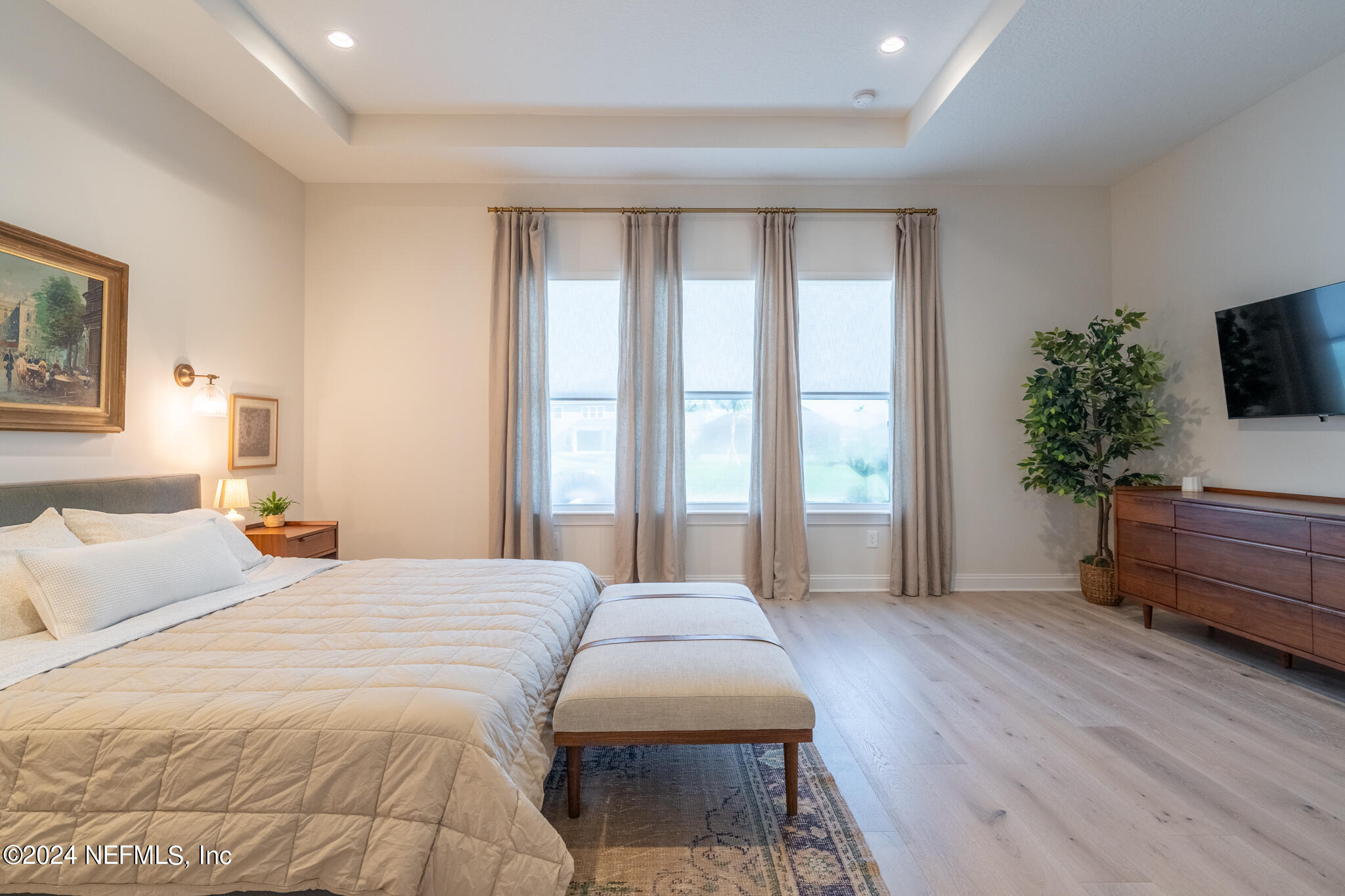 88 Awlleaf Court St. Augustine, FL 32095 - Photo 43 of 107 a spacious bedroom with a large bed and a potted plant