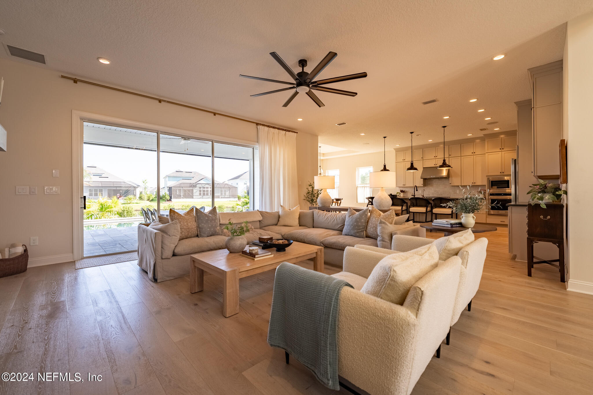 88 Awlleaf Court St. Augustine, FL 32095 - Photo 49 of 107 a living room with furniture wooden floor and a large window