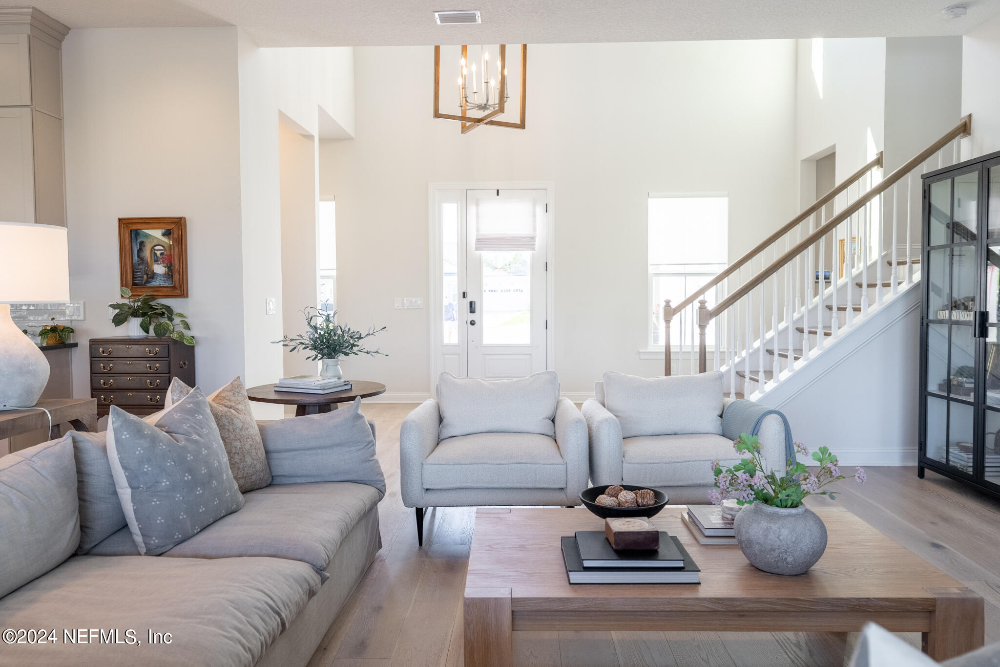 88 Awlleaf Court St. Augustine, FL 32095 - Photo 50 of 107 a living room with furniture potted plant and a window