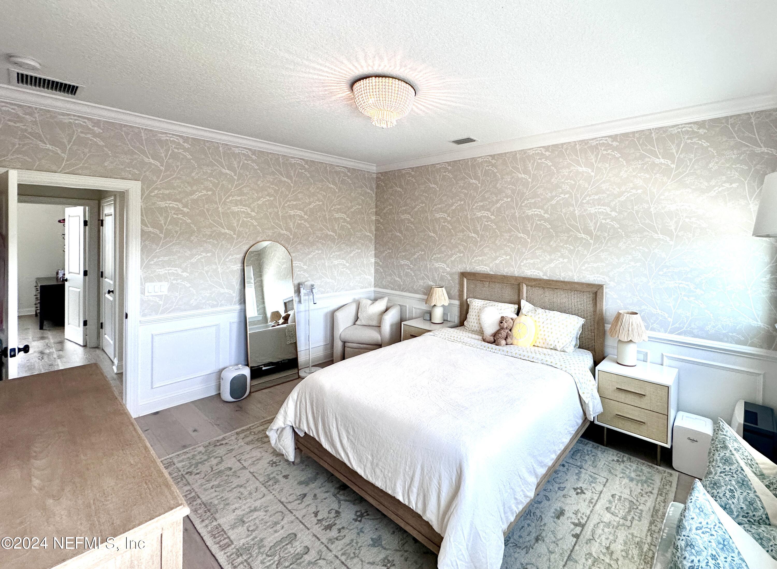 88 Awlleaf Court St. Augustine, FL 32095 - Photo 56 of 107 a bedroom with a bed and a view of bathroom