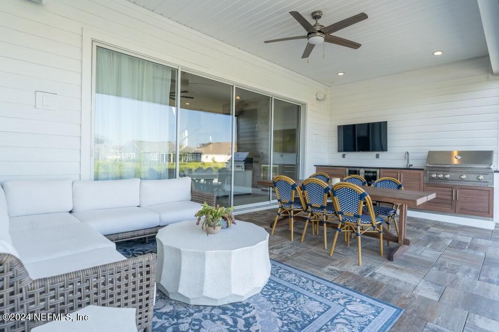 88 Awlleaf Court St. Augustine, FL 32095 - Photo 90 of 107 a living room with furniture and a flat screen tv