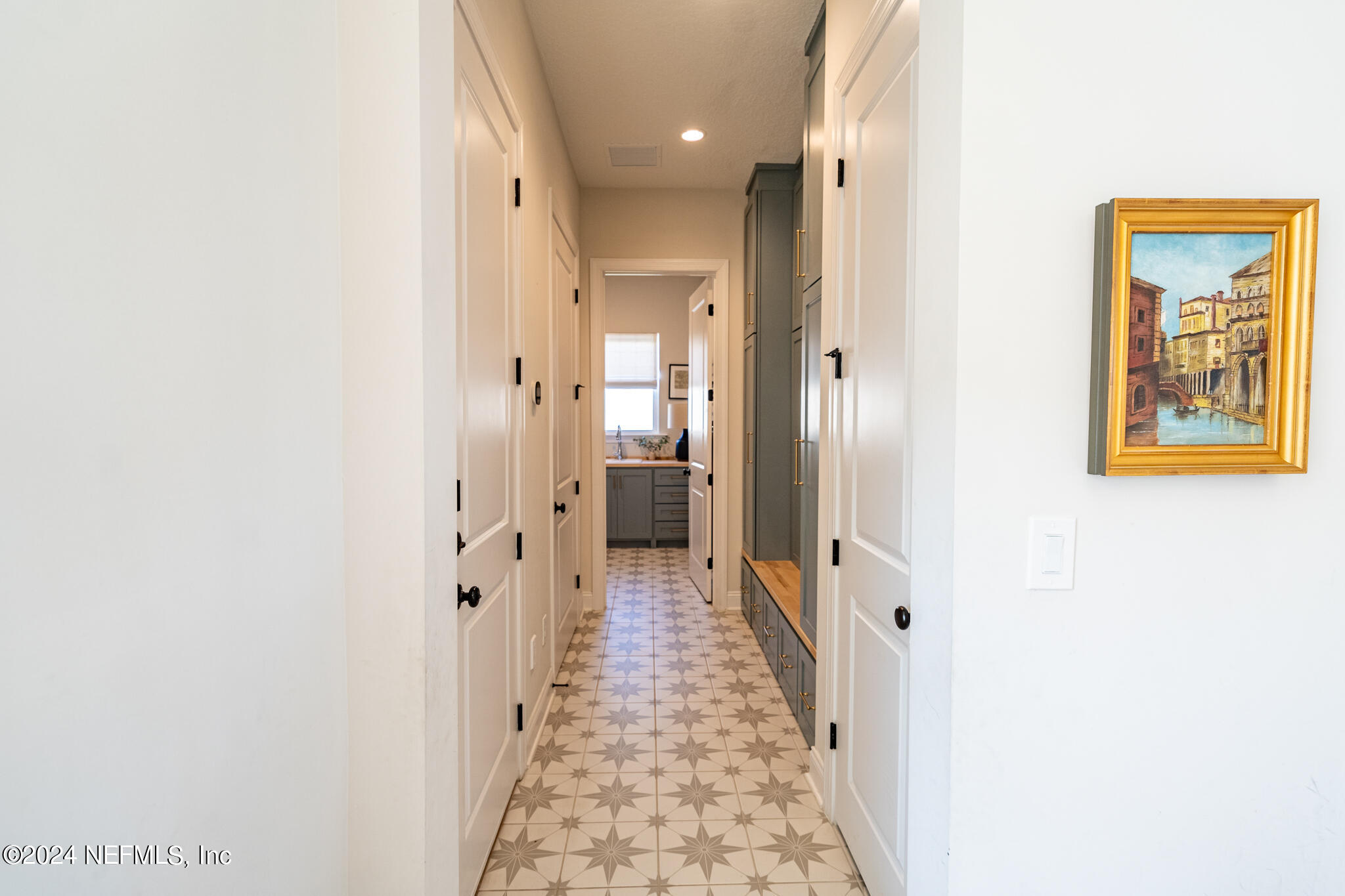 88 Awlleaf Court St. Augustine, FL 32095 - Photo 9 of 107 a view of a hallway with wooden floor and a bathroom