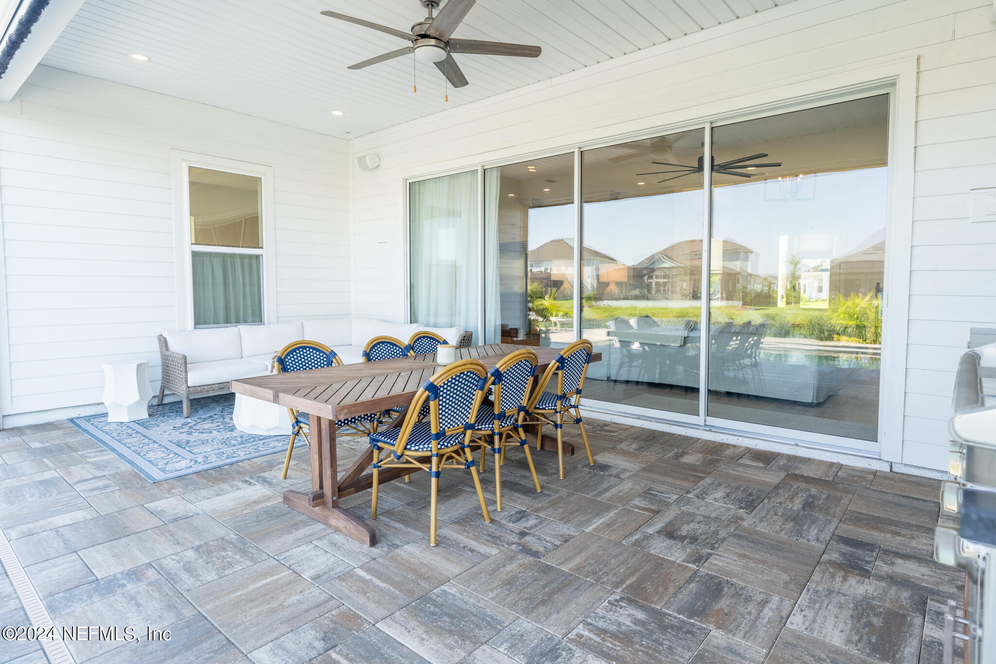 88 Awlleaf Court St. Augustine, FL 32095 - Photo 91 of 107 a dining room with furniture a chandelier and a rug