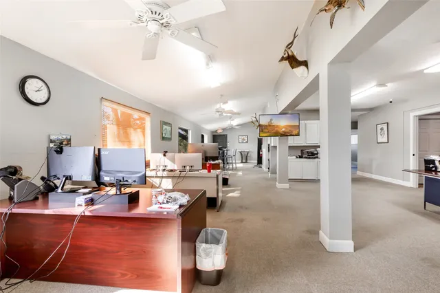 a large room with lots of chairs and chandelier