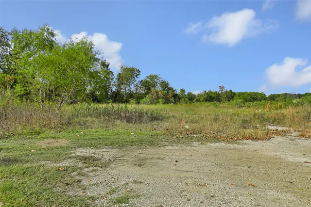 a view of a lake with houses in the back