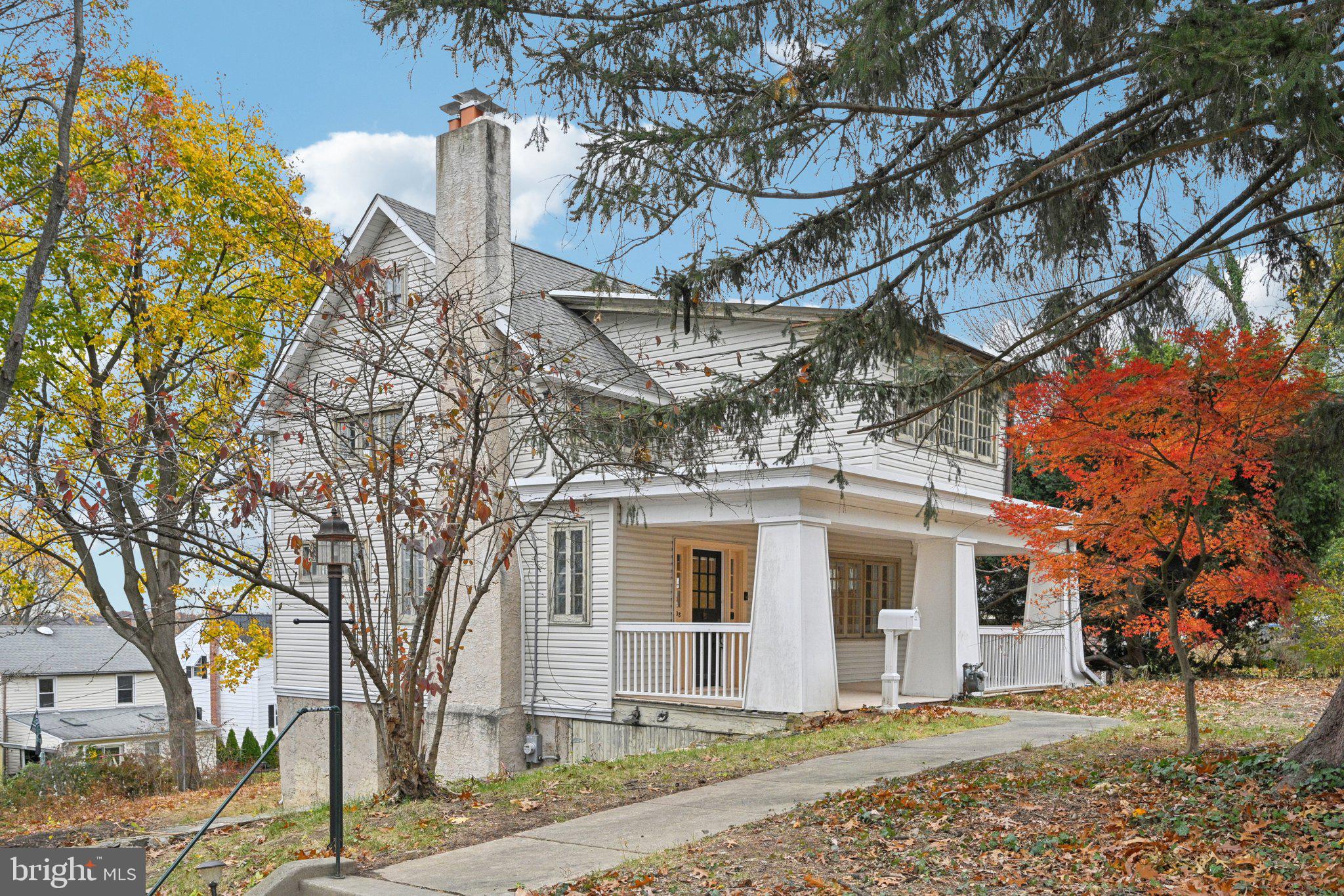 908 Edge Hill Road Glenside, PA 19038 - Photo 2 of 27 a front view of a house with a yard