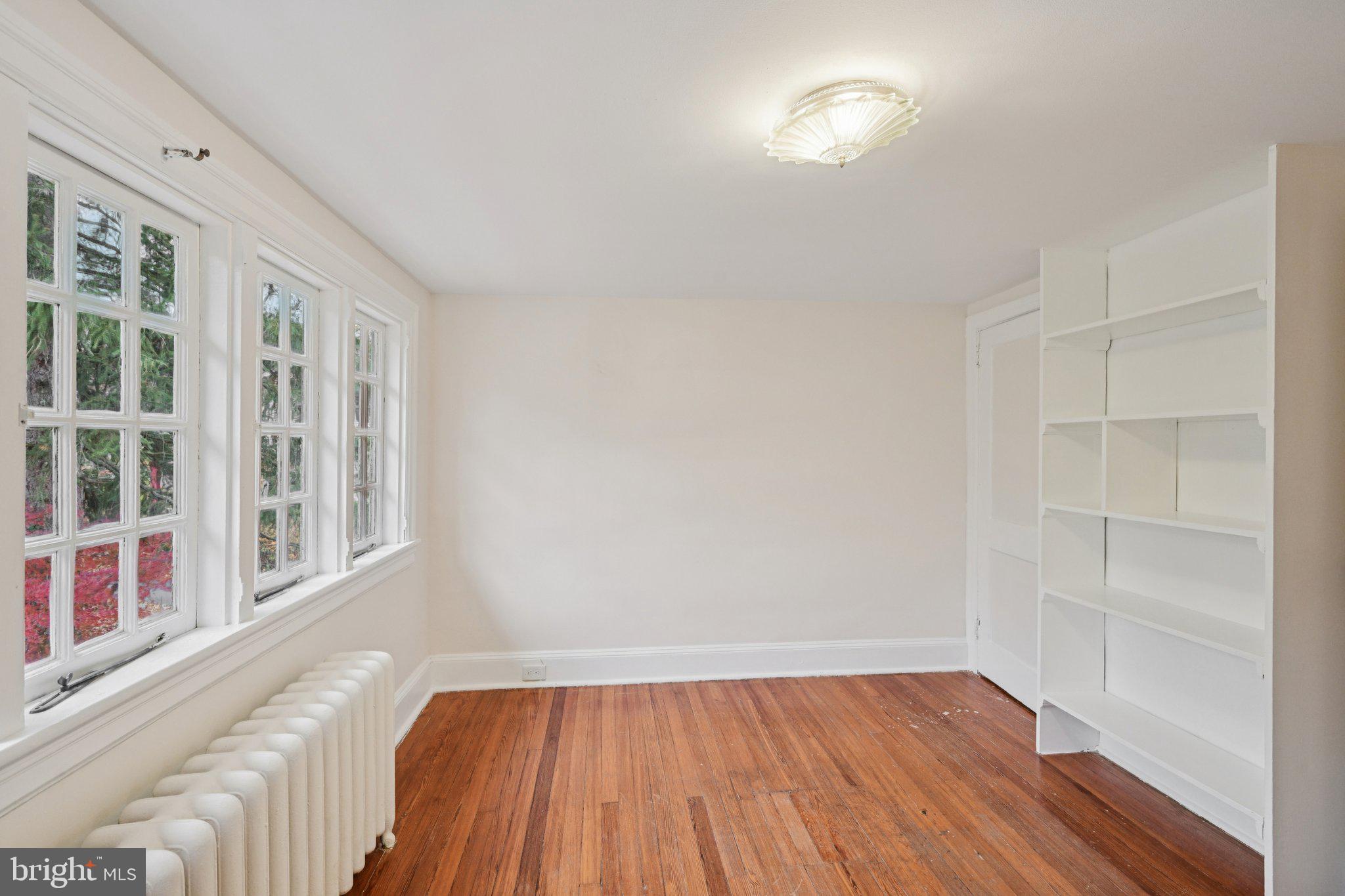 908 Edge Hill Road Glenside, PA 19038 - Photo 22 of 27 wooden floor in an empty room with a window