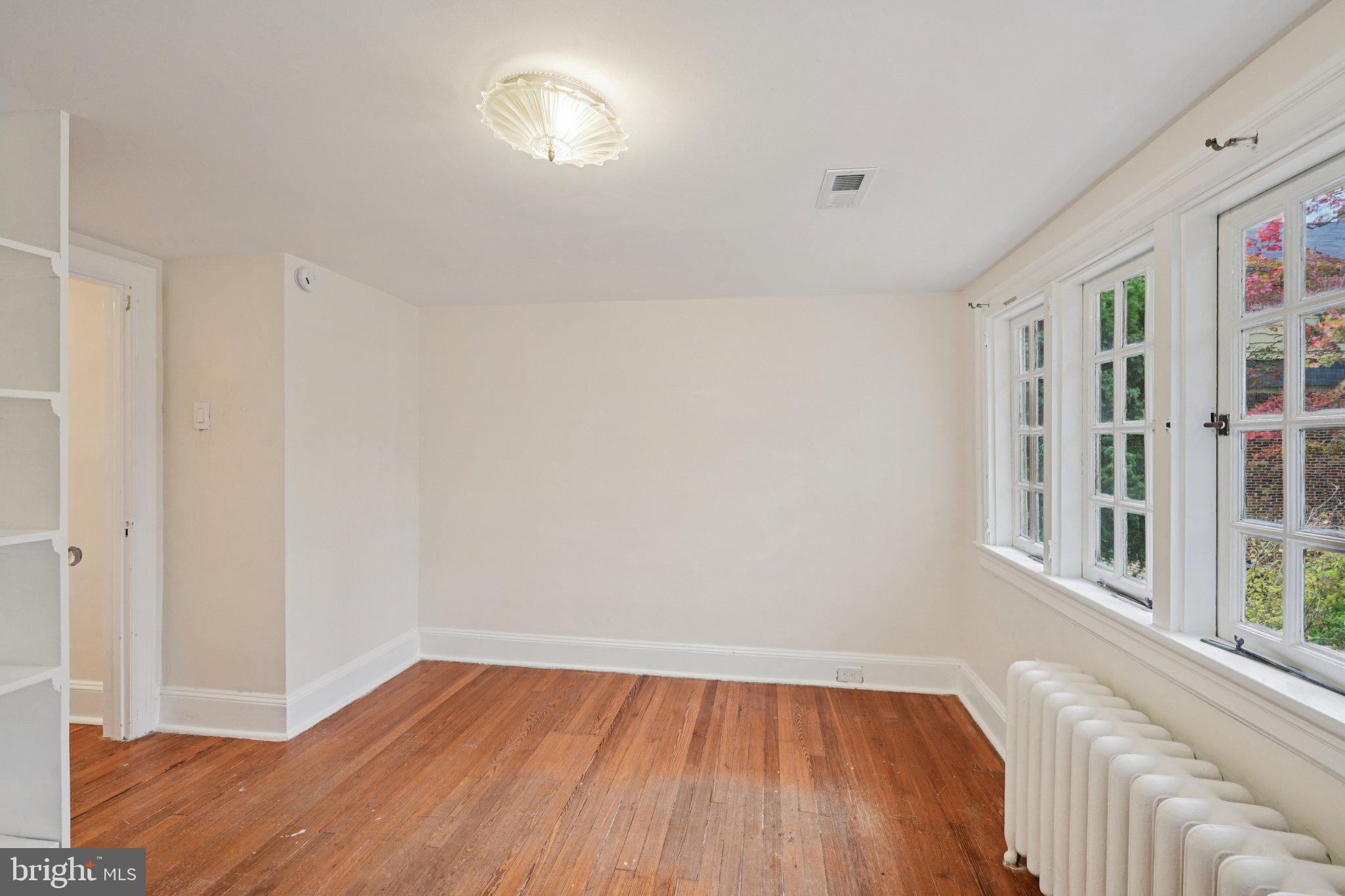 908 Edge Hill Road Glenside, PA 19038 - Photo 23 of 27 a view of a livingroom with wooden floor and a window