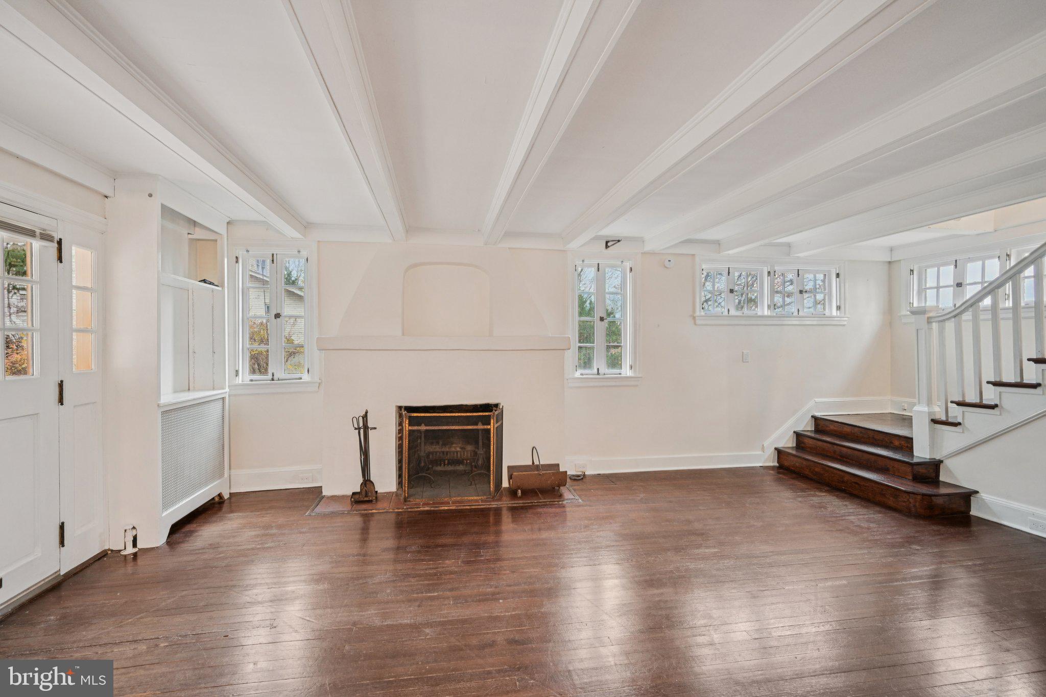 908 Edge Hill Road Glenside, PA 19038 - Photo 6 of 27 a view of livingroom with hardwood floor and a ceiling fan