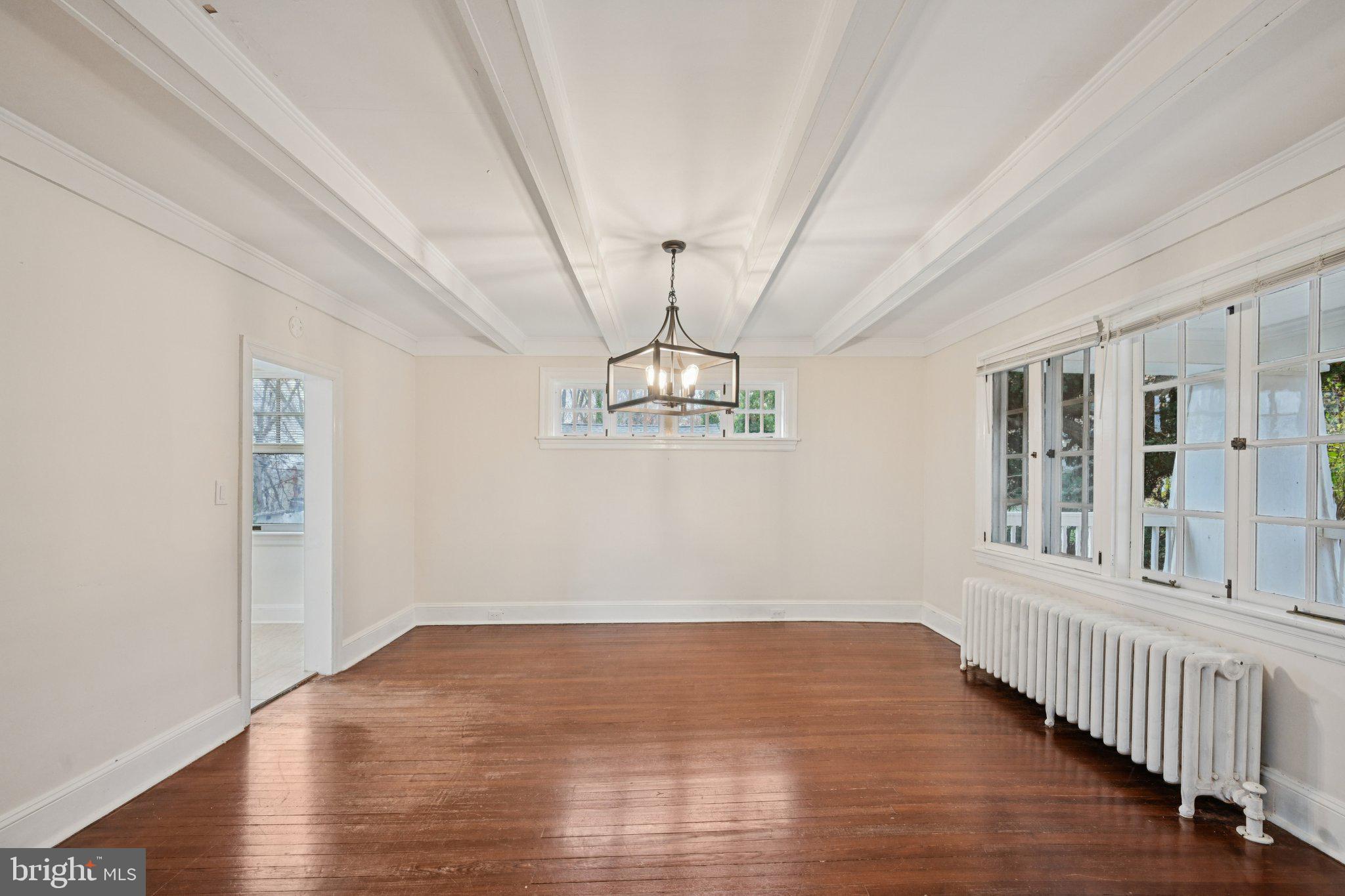 908 Edge Hill Road Glenside, PA 19038 - Photo 9 of 27 a view of a room with wooden floor chandelier and windows