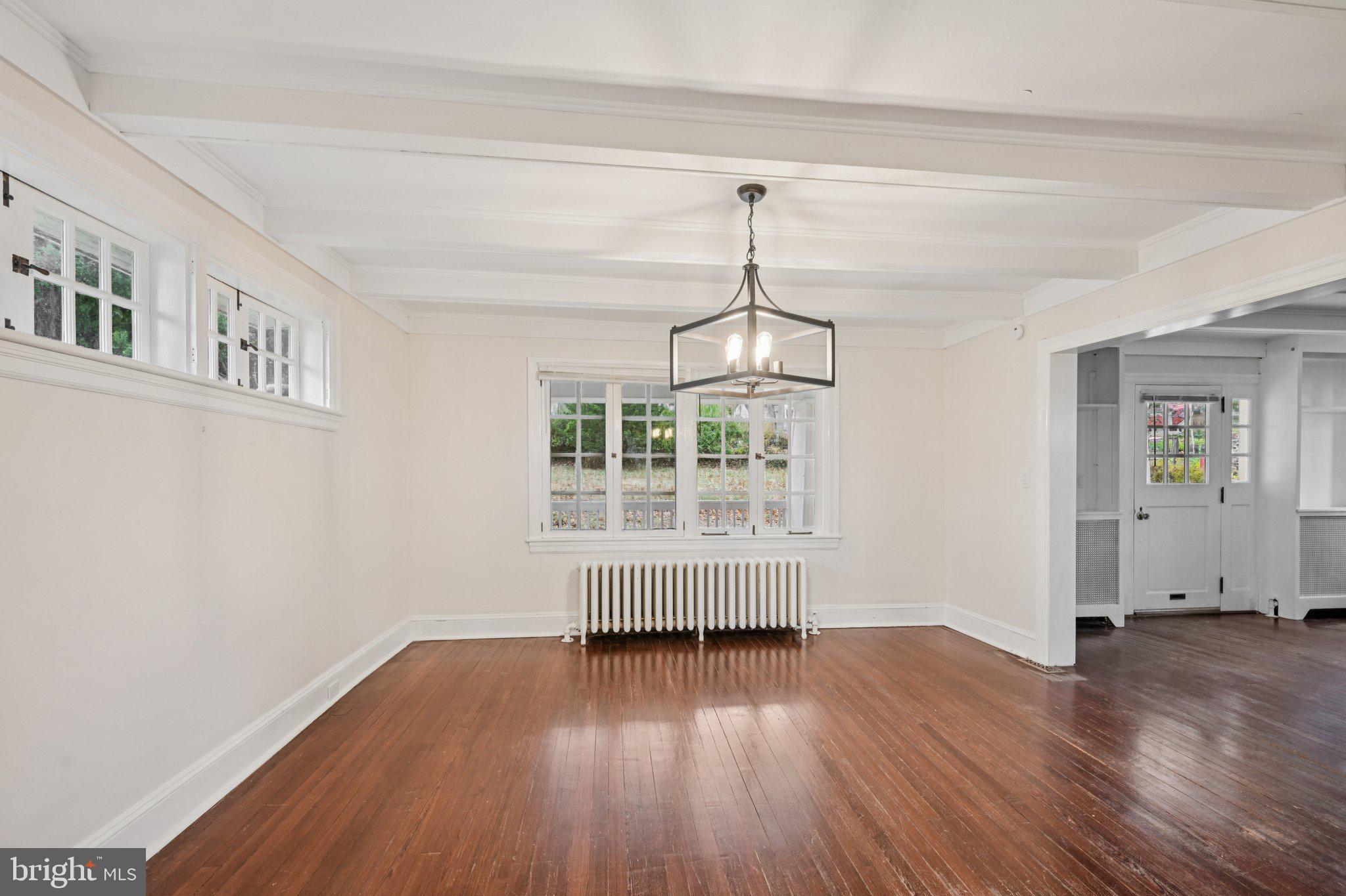 908 Edge Hill Road Glenside, PA 19038 - Photo 10 of 27 a view of empty room with wooden floor and fan