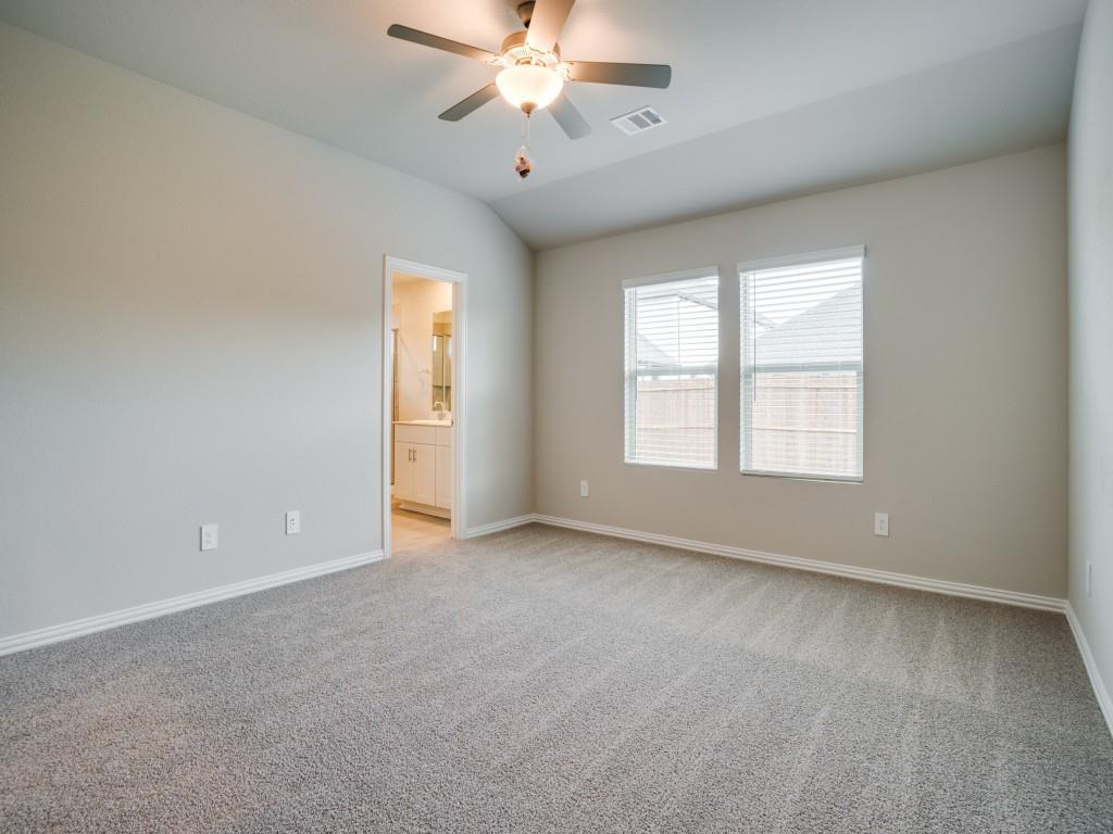808 Tidal Drive McKinney, TX 75071 - Photo 15 of 26 an empty room with windows and chandelier fan