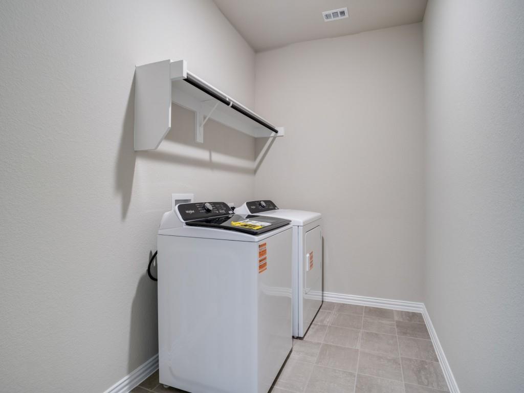 808 Tidal Drive McKinney, TX 75071 - Photo 23 of 26 a utility room with dryer and washer