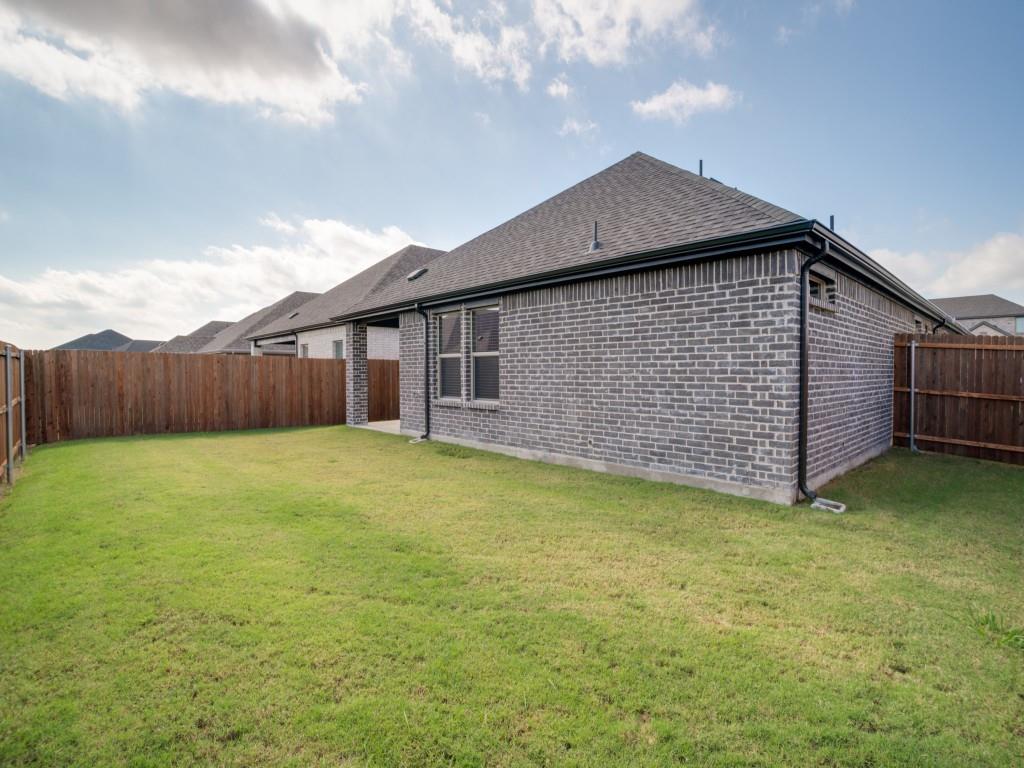 808 Tidal Drive McKinney, TX 75071 - Photo 26 of 26 a backyard of a house with lots of green space