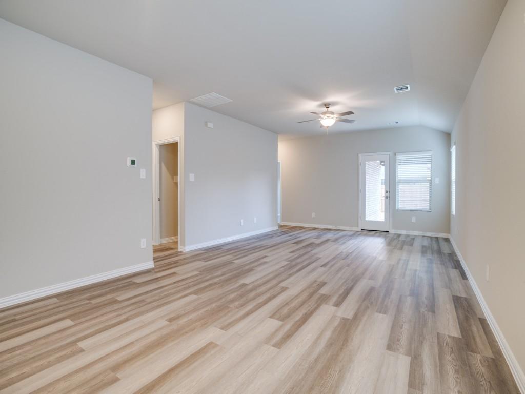 808 Tidal Drive McKinney, TX 75071 - Photo 5 of 26 wooden floor in an empty room with a window